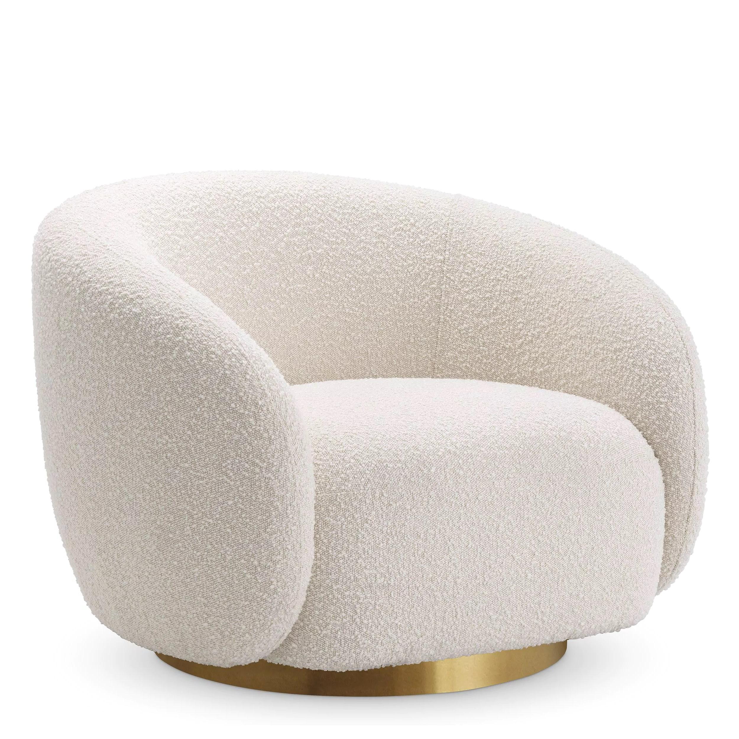 Welcoming and curved swivel armchair in beige bouclé fabric with brass finishes base.
