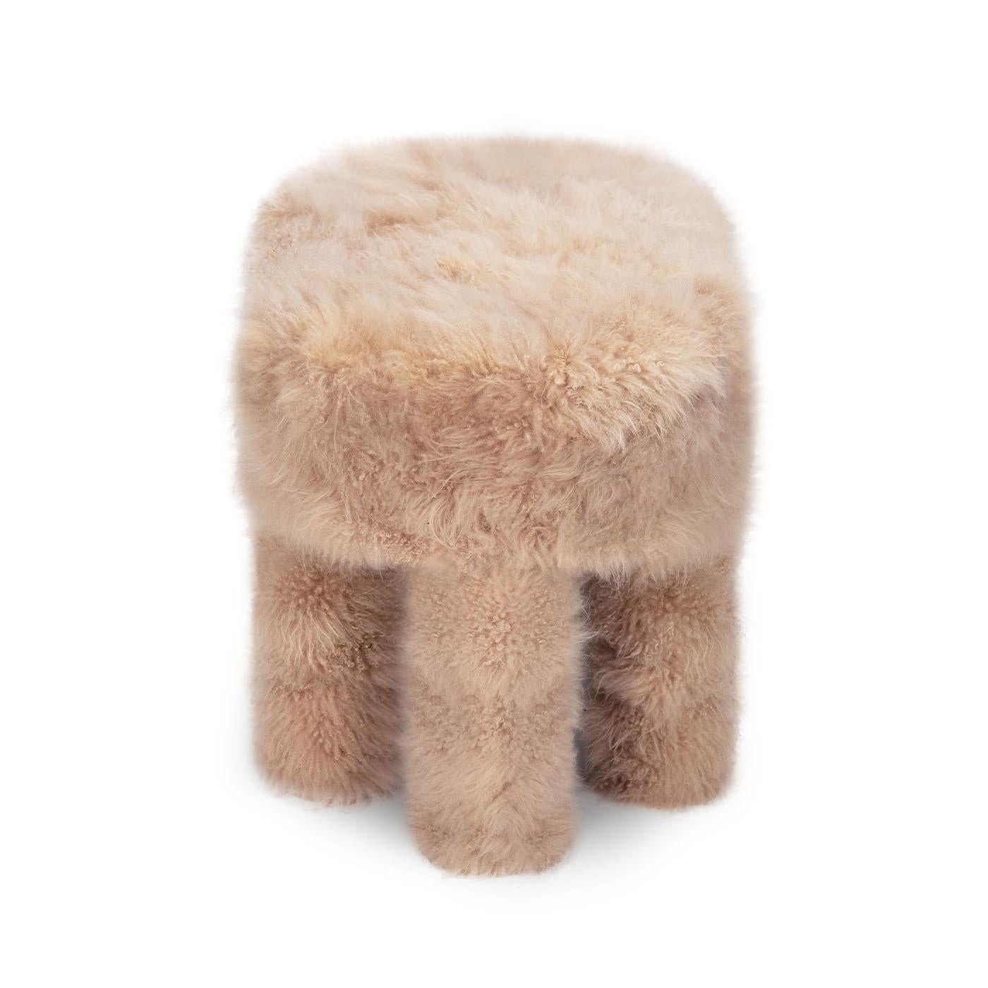Wrapped in sumptuous beige cashmere fur, this unique pouf radiates warmth and charm. Its beech wood structure, complemented by four sturdy legs draped in soft cashmere, creates a distinctive and unconventional design. Handcrafted in Italy with