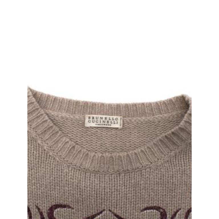 Brunello Cucinelli Beige Cashmere Urban Legends Knitted Top
 

 - Lightweight pure cashmere yarn, in a light beige hue
 - Boxy fit, round neck short sleeve shape
 - Urban Legends printed script to the front 
 

 Materials
 100% Cashmere 
 

 Made In