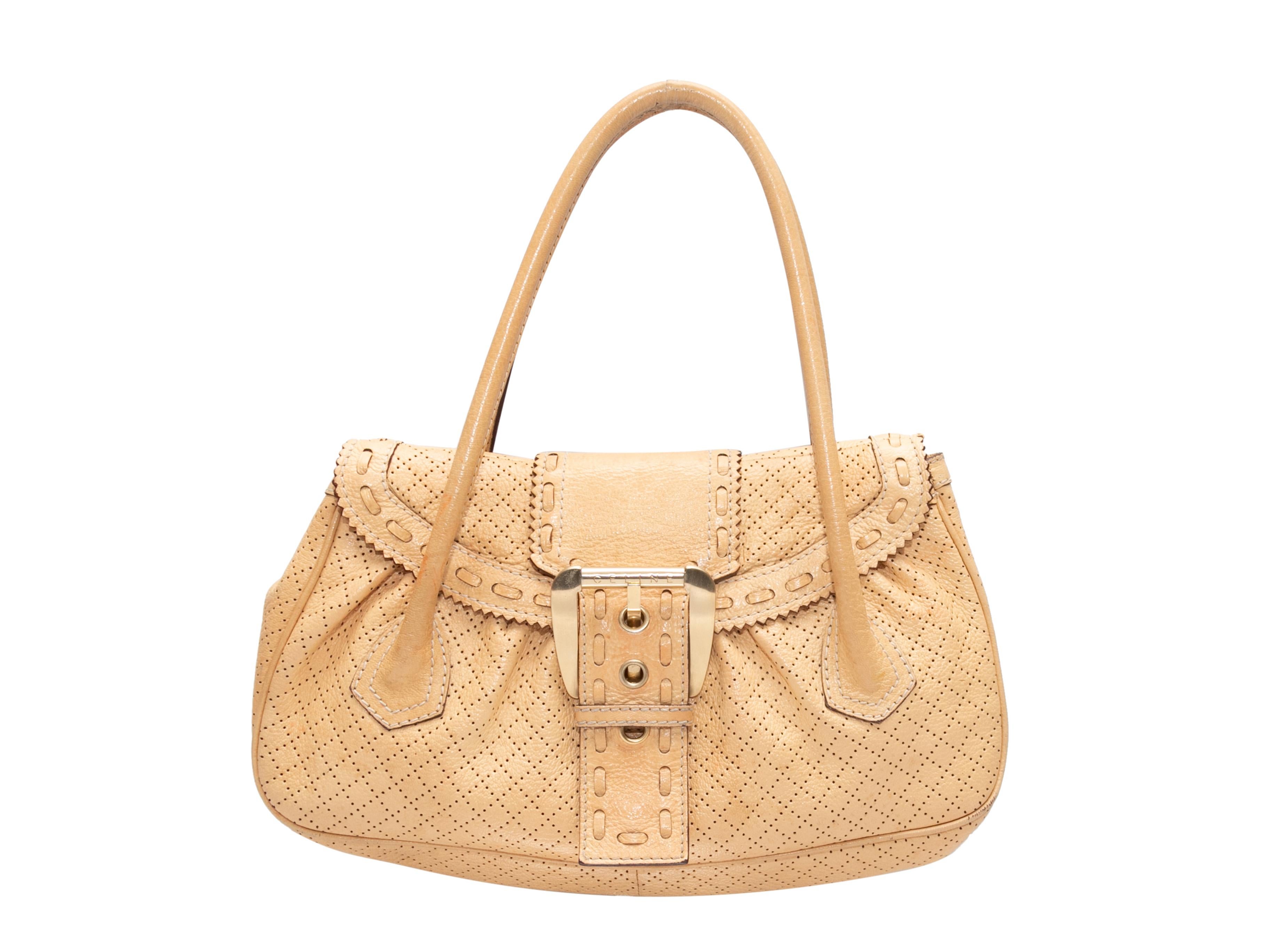 Beige Celine Perforated Leather Buckle Shoulder Bag. This shoulder bag features a leather body, gold-tone hardware, dual rolled shoulder straps, and a front buckle closure. 13.75