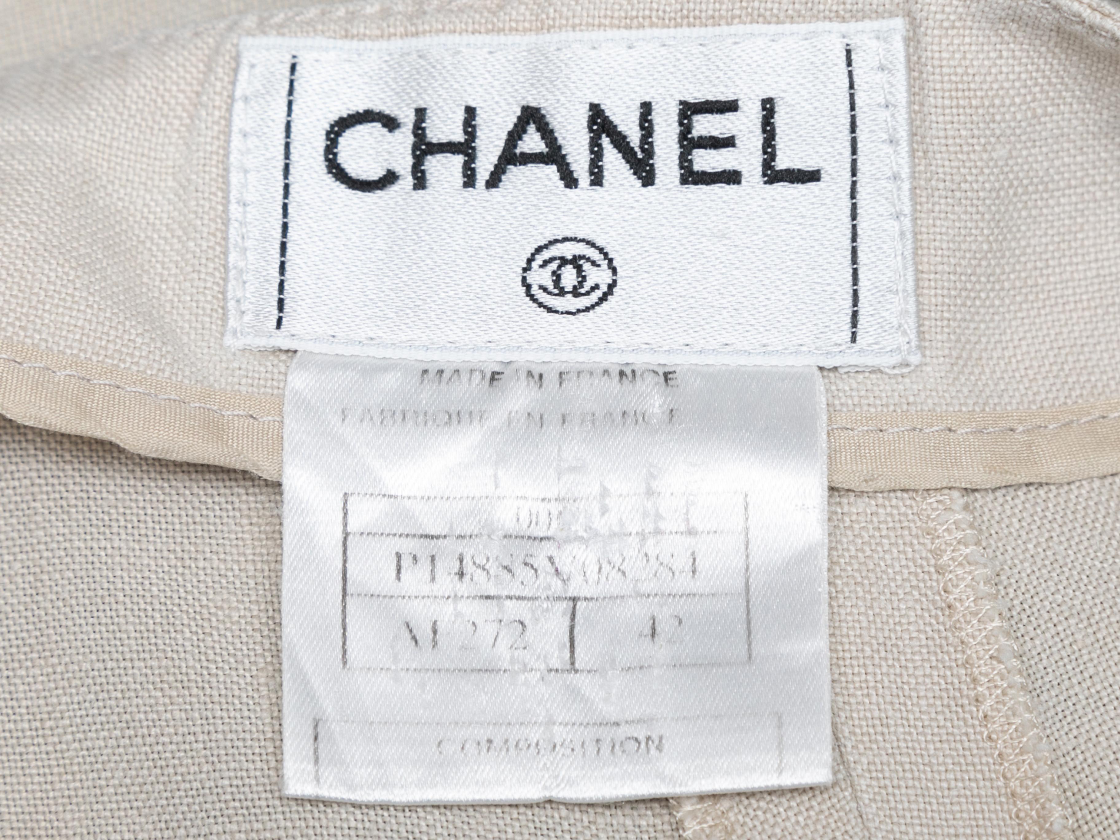 Beige linen straight-leg trousers by Chanel. Zip closure at side. 30