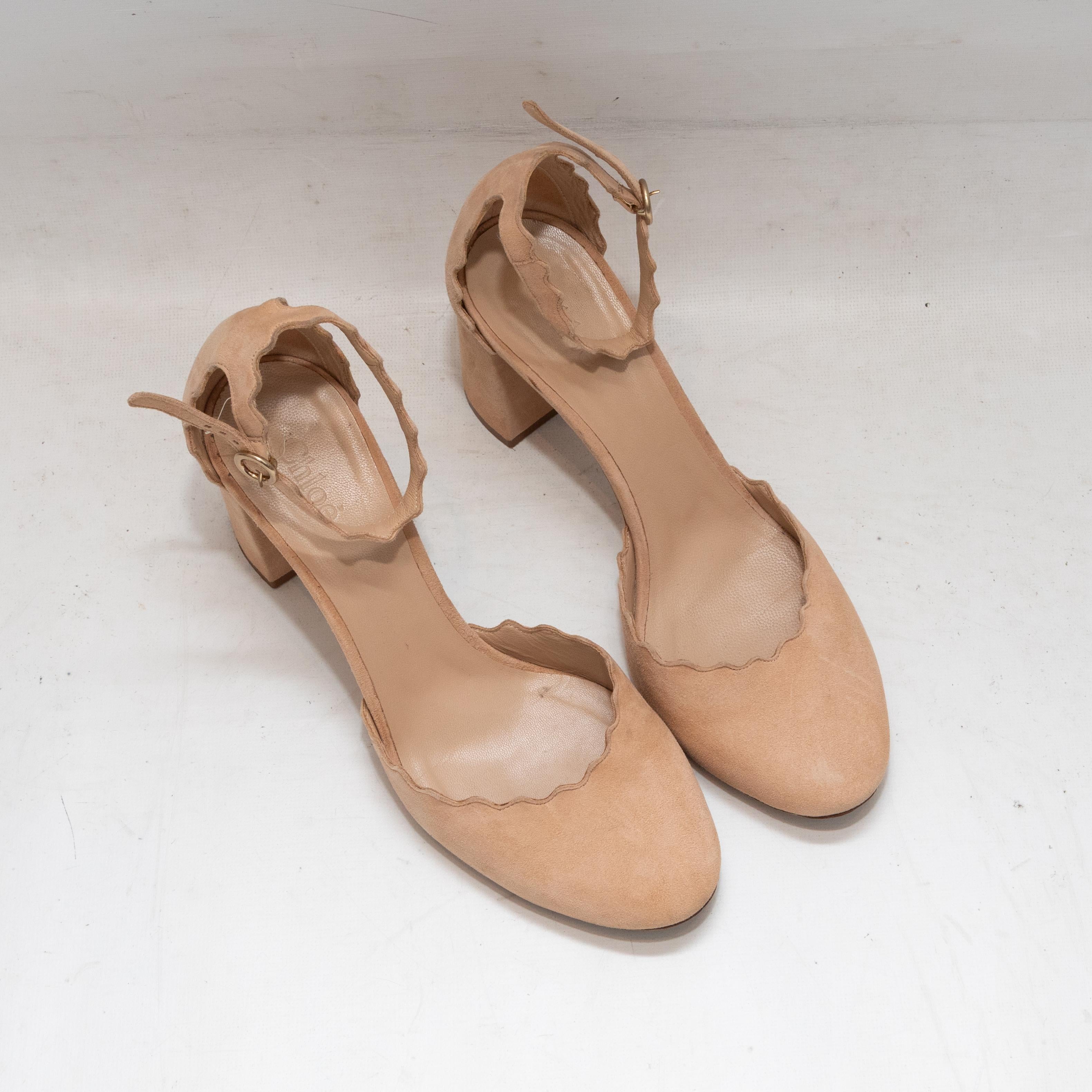 Beige suede Lauren scalloped d'Orsay heels by Chloe. Block heels. Buckle closures at ankle straps. 3