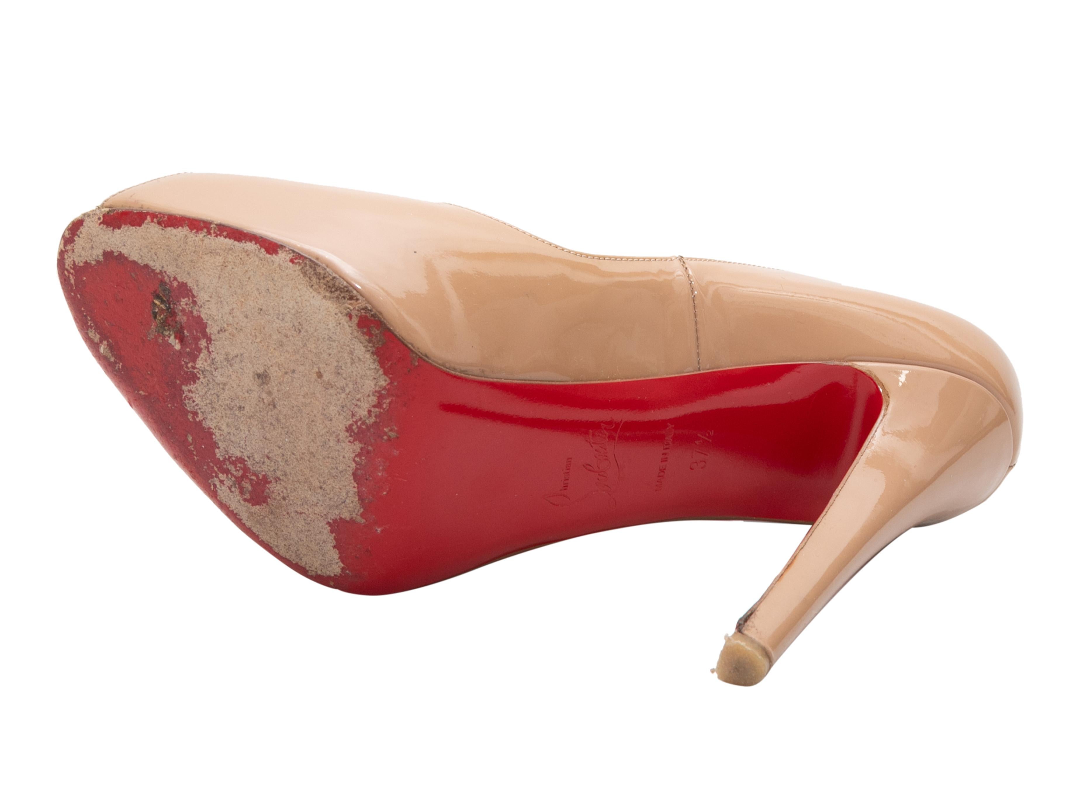 Beige patent leather peep-toe pumps by Christian Louboutin. 4.75