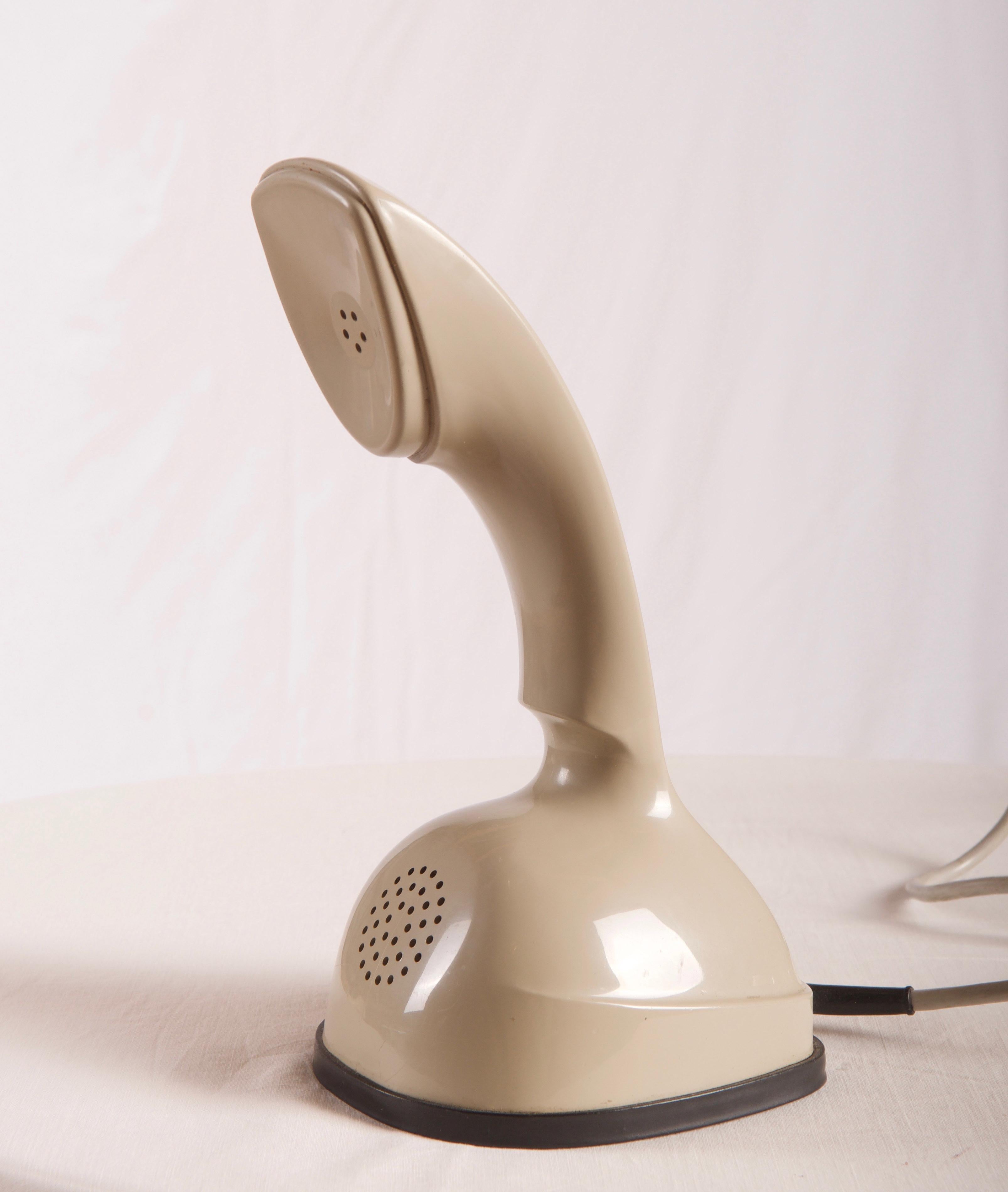 Vintage rotary dial beige Ericofone. This is the model Cobra. It is made of cream thermoplastic ABS
Designed in the 1950s in Sweden by Hugo Blomberg, Ralph Lysell and Gösta Thames, LM Ericsson.
         