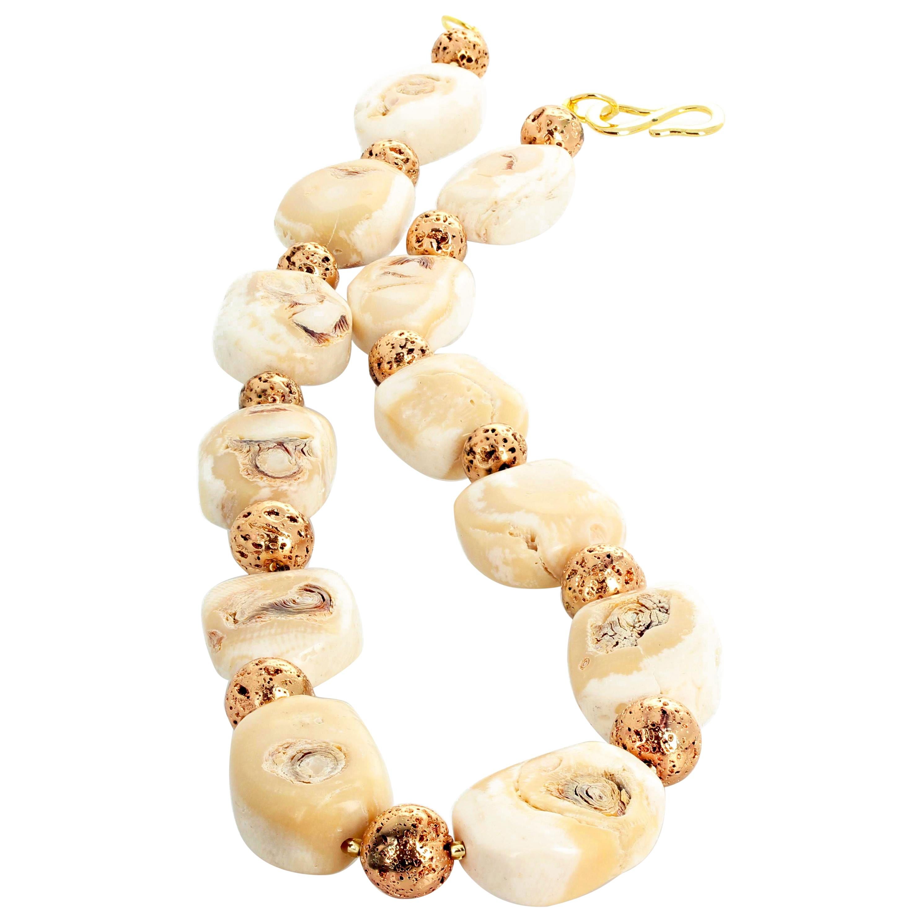 This damatically beautiful 21 inch long natural Beige Coral necklace is enhanced with gold plated round fascinating real Lava beads set with an easy to use gold plated hook clasp.  These real Corals are approximately 30 mm x 22 mm.  The largest