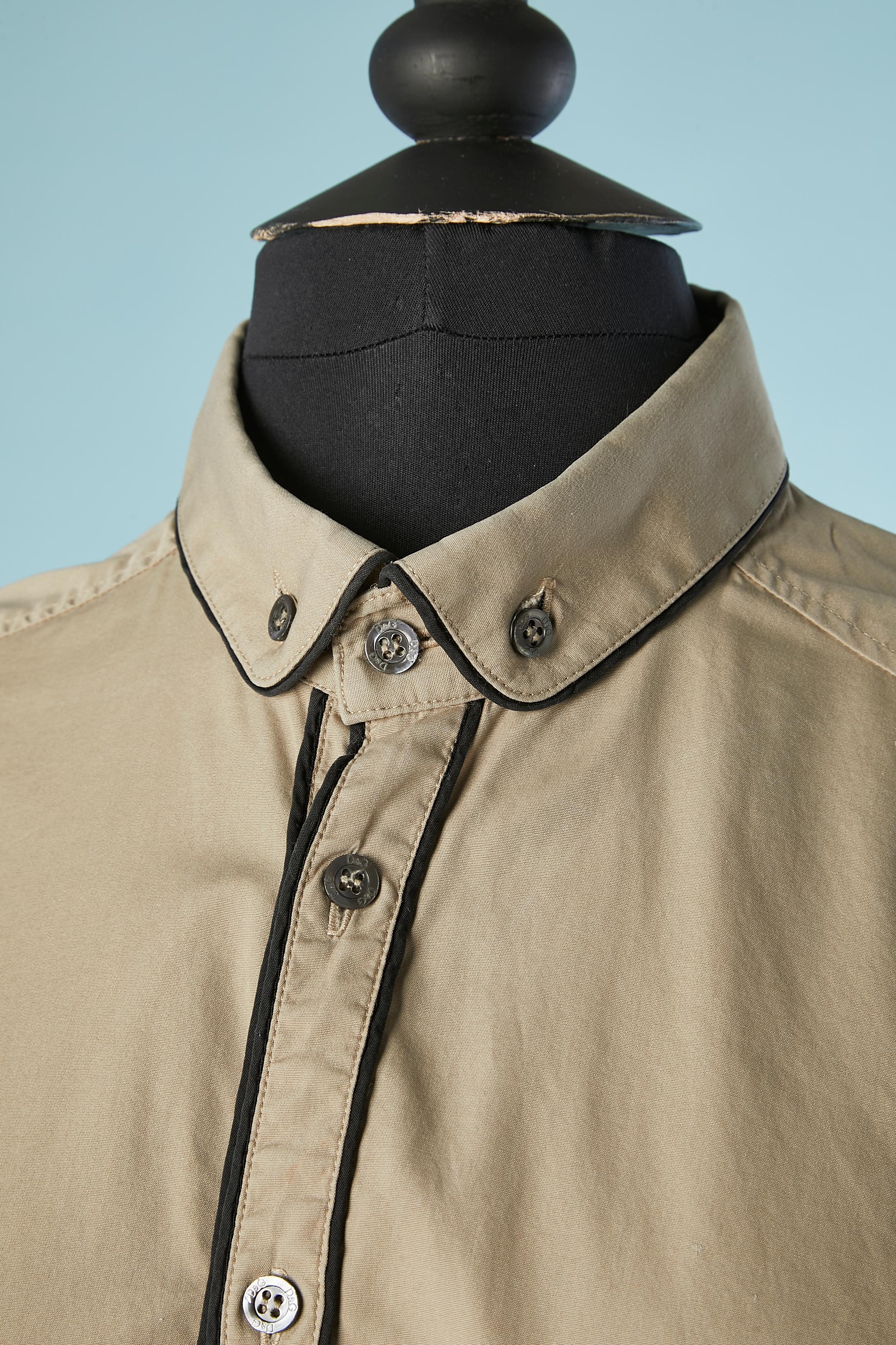 Beige cotton shirt with black piping . Mother of shell button and buttonhole closure on the middle front and on the cuffs. Authenticity hologram. 
SIZE on tag 48 (It) but fit more likely M 