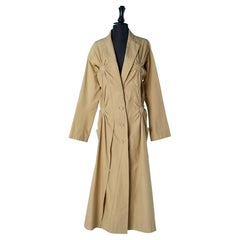 Beige cotton trench-coat with round cut-work with gather ISSEY MIYAKE
