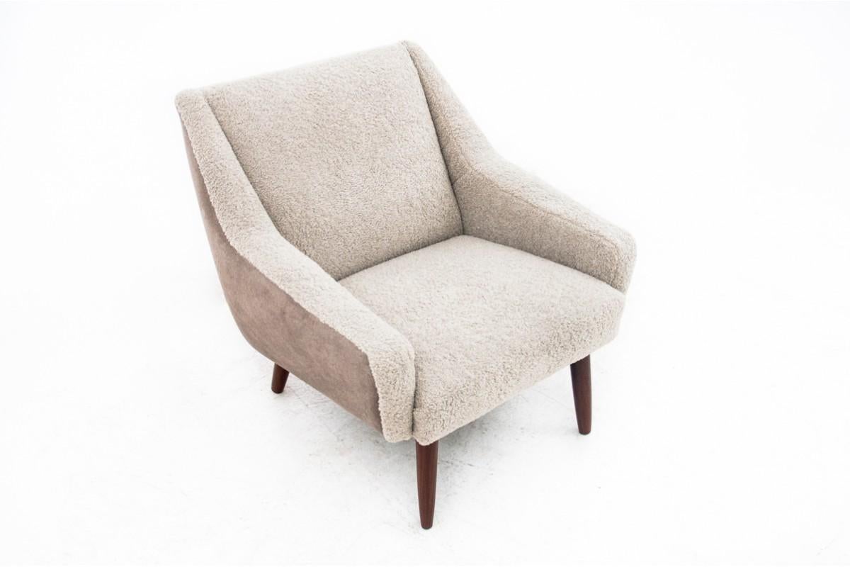 Vintage armchair, produced in Denmark in circa 1960s. 
Restored, Material changed for beige bouclé.
Very good condition, ready to be put into interior.
Leg's wood : Teak
Dimensions: Height 74 cm / seat height 40 cm / width 77 cm / depth 80