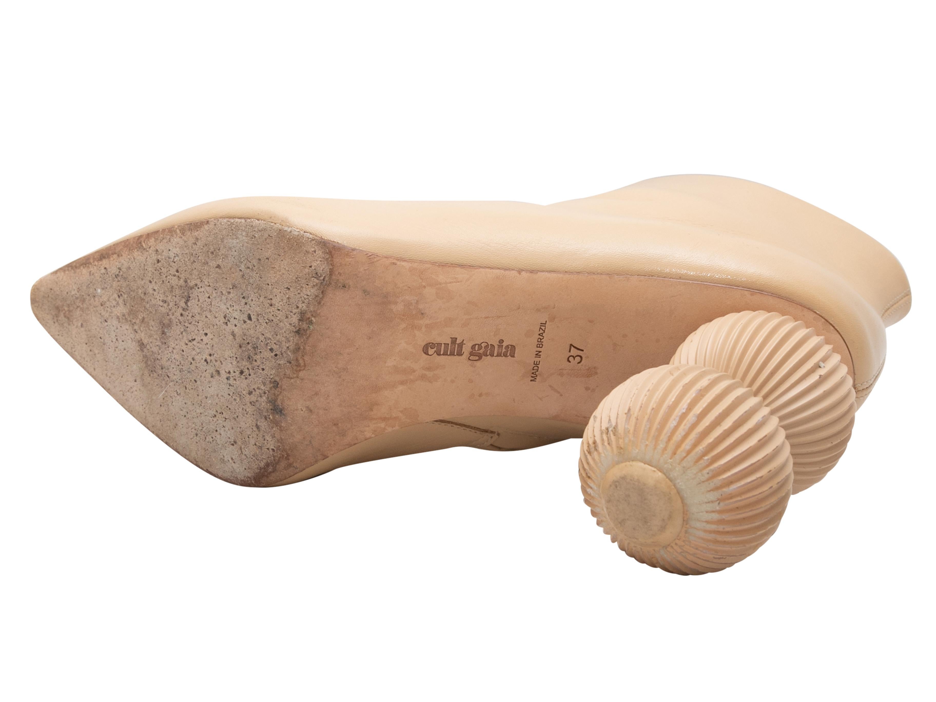 Beige Cam Bauble leather pointed-toe ankle boots by Cult Gaia. Zip closures at inner sides. 4