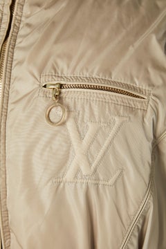 Beige down jacket with brown furs collar and branded belt Louis Vuitton
