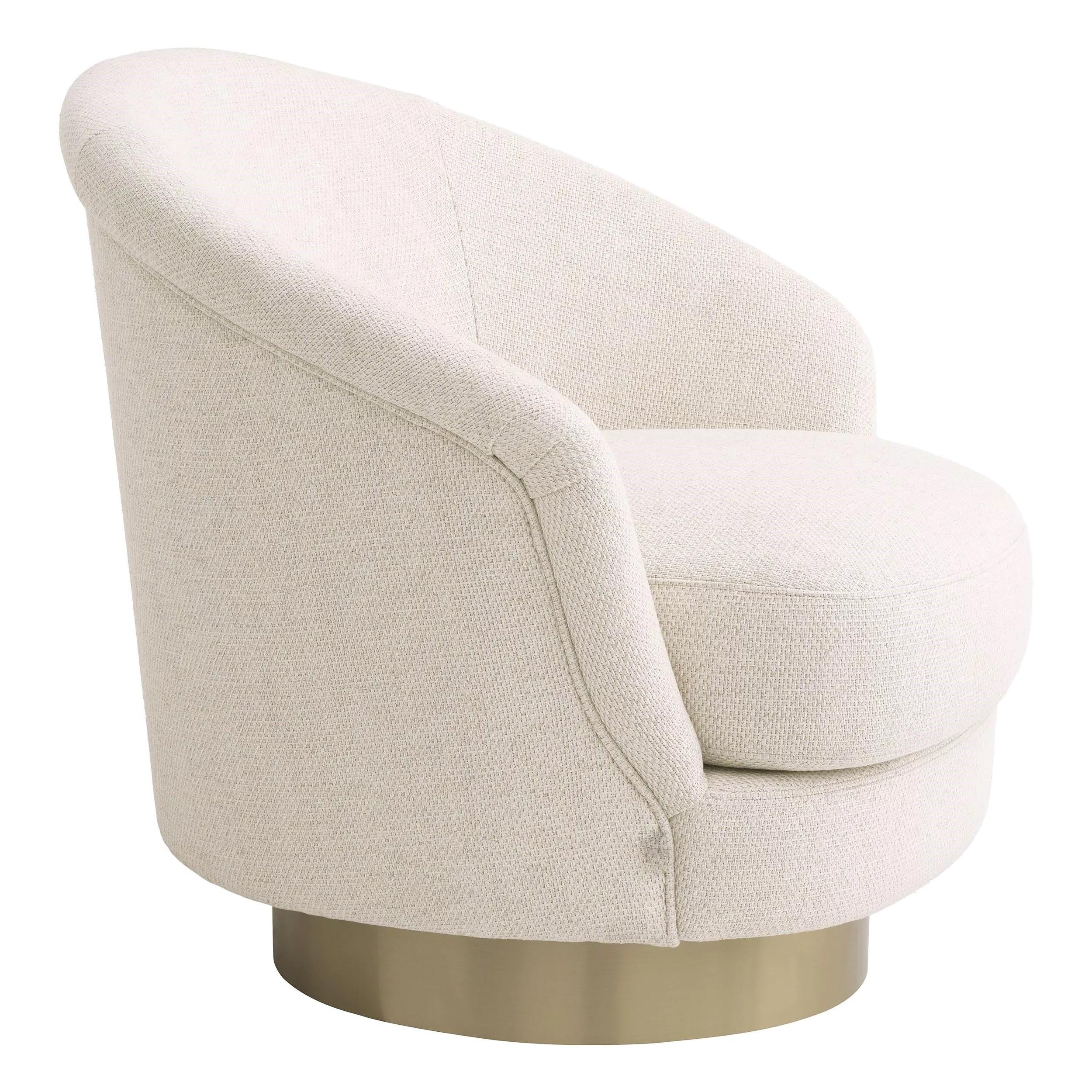 Welcoming and curved swivel armchair in beige fabric with brass finishes base.