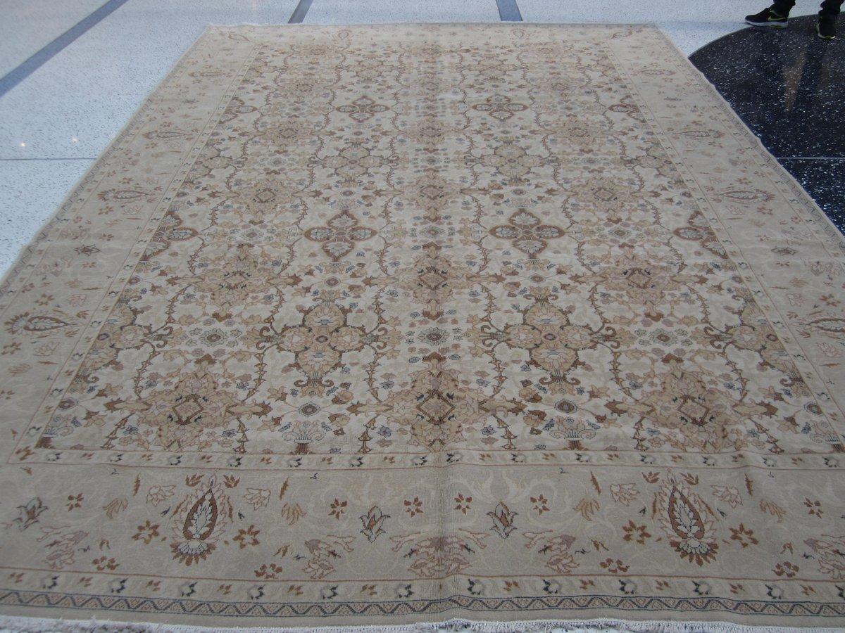 The dramatic and unique centre floral pattern makes this rug stand out from the rest. Ochre, gold and light blue tones against a beige background give it a wonderful warmth and balance suitable for any space.