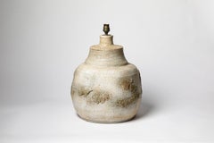 Beige glazed ceramic table lamp by Huguette et Marius Bessonne, circa 1960.