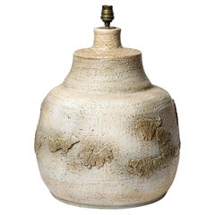 Beige glazed ceramic table lamp by Huguette et Marius Bessonne, circa 1960.