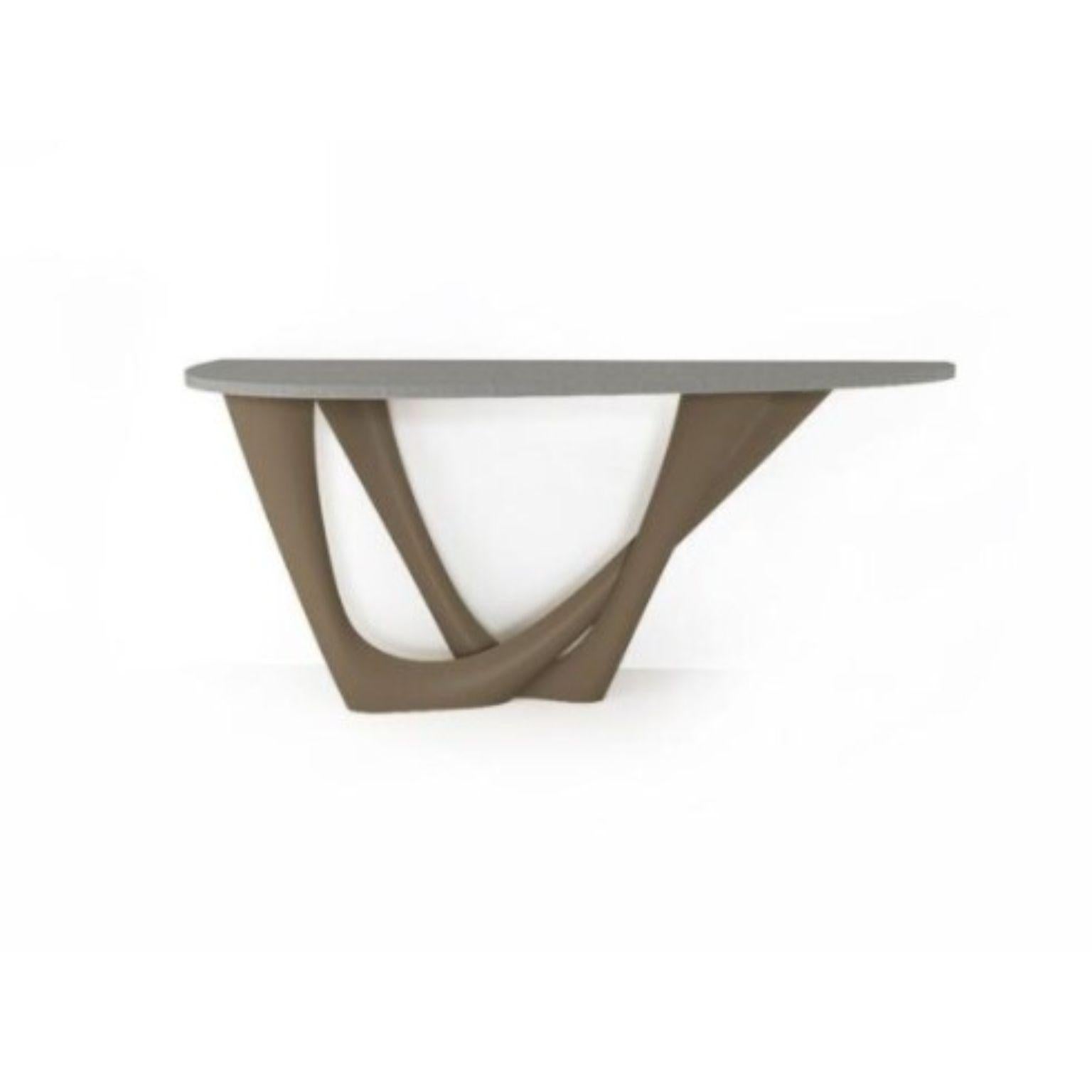 Beige Grey G-Console Duo concrete top and steel base by Zieta
Dimensions: D 56 x W 168 x H 75 cm 
Material: Carbon steel, concrete.
Also available in different colors and dimensions.

G-Console is another bionic object in our collection. Created for