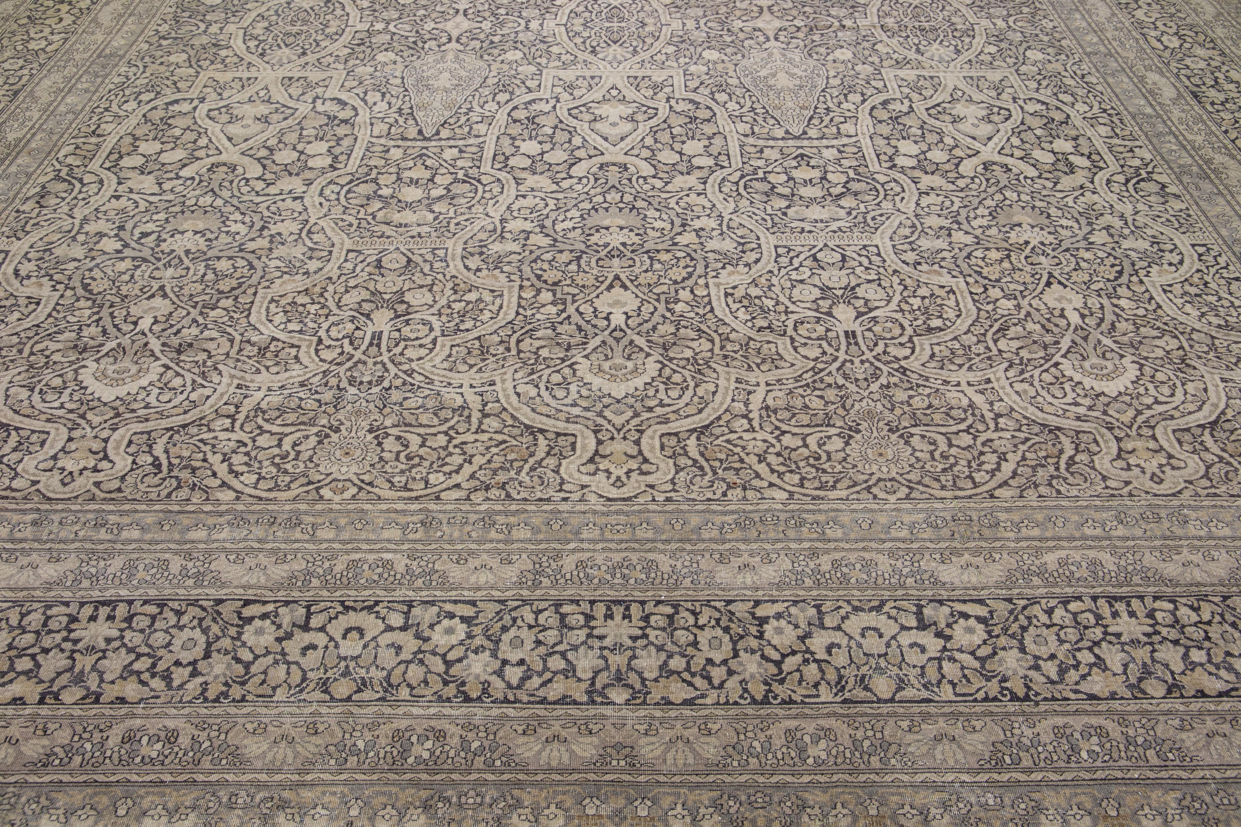 Beautiful Sivas hand-knotted wool rug with a gray field. This piece has a designed frame with brown and beige accents in a gorgeous classic all-over floral design.  Its quality craftsmanship makes it an excellent choice as you are investing in a rug