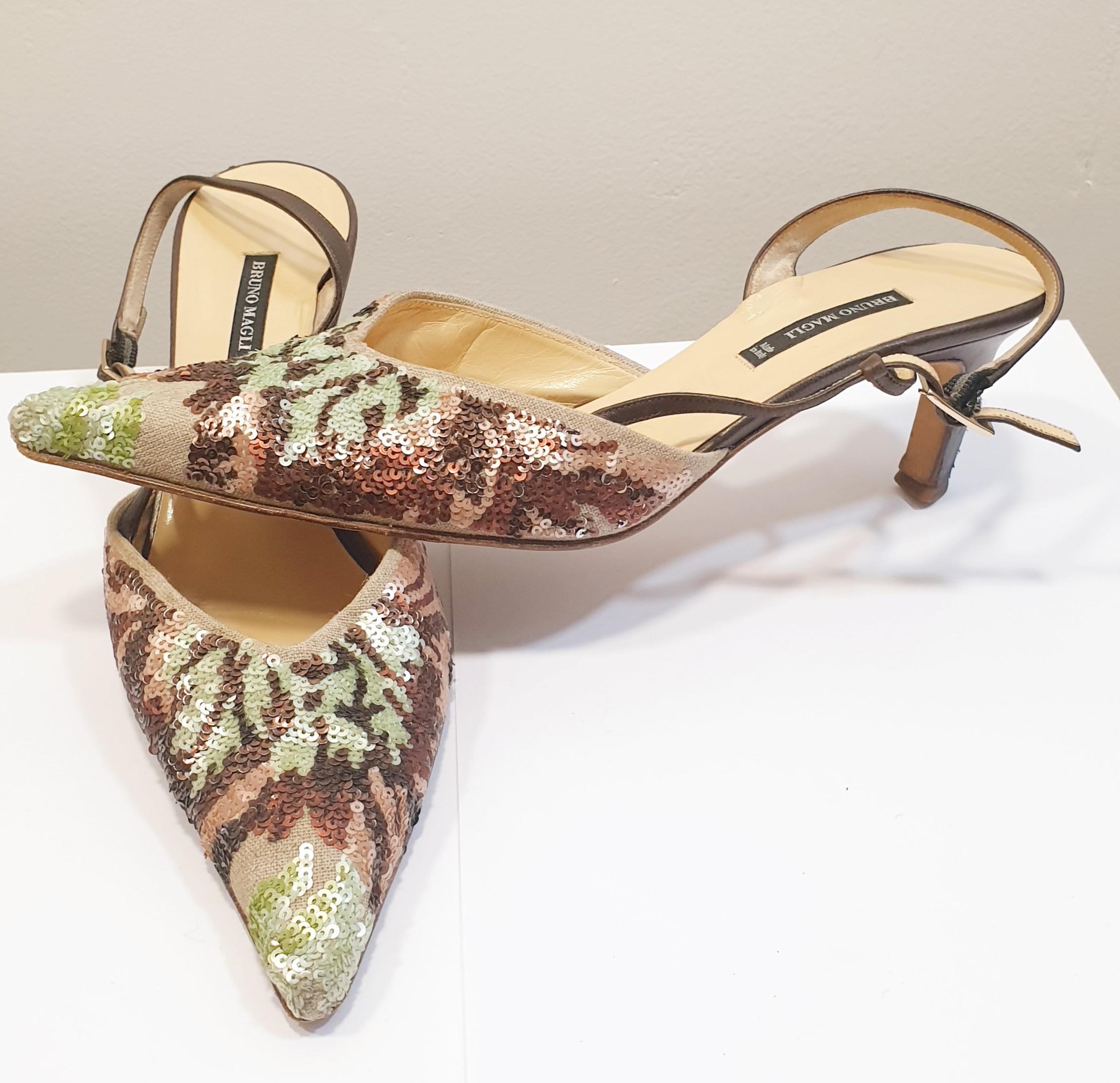 Beige heeled sandals with sequins by Bruno Magli and brown leather peep toe 
Bruno Magli has been producing quality Italian leather goods since 1936. 
These ultra feminine peep toe pumps are a beautiful combination of jade green, blue and plum