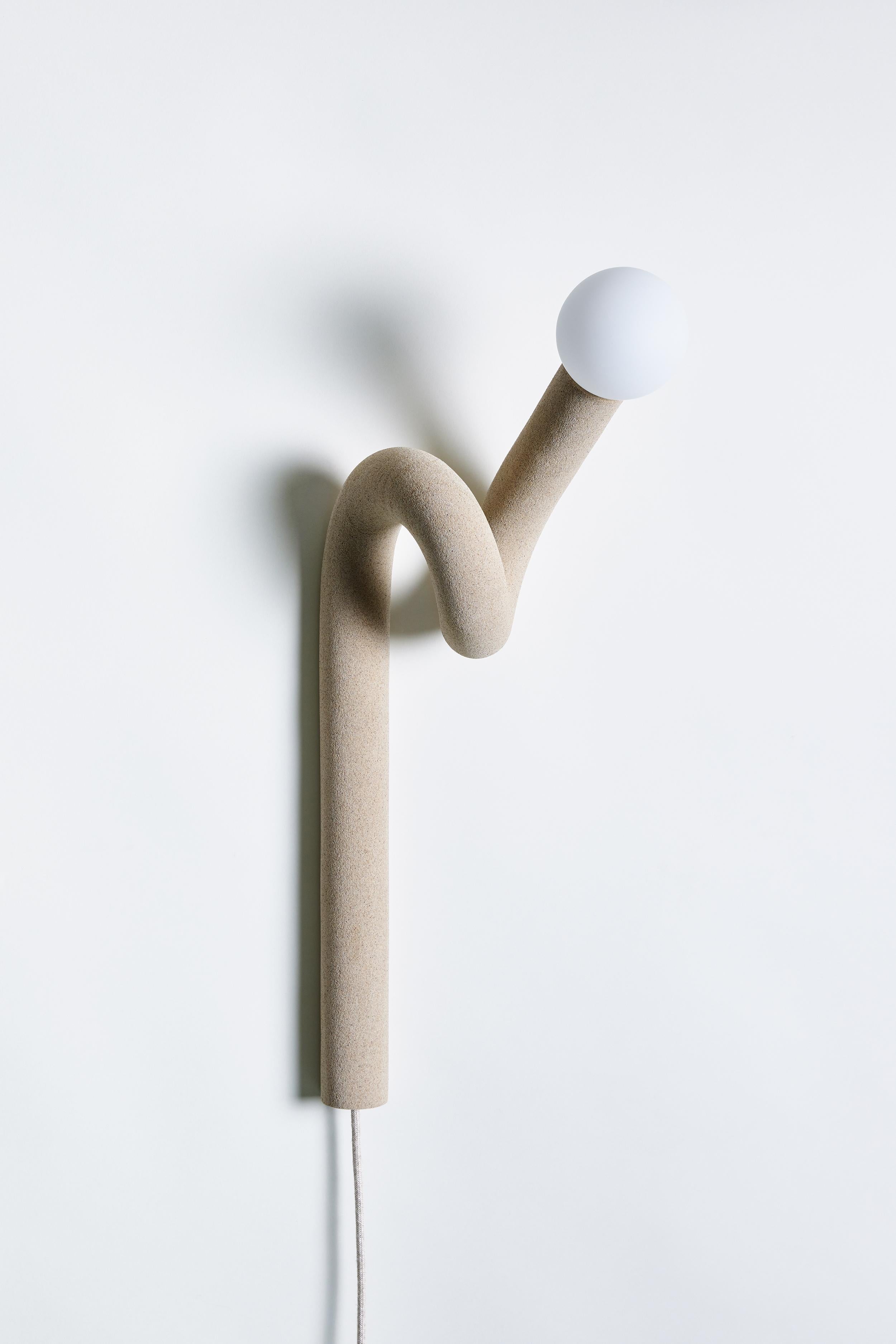 Beige Hotel Light 11 Wall Light by Hot Wire Extensions
Dimensions: D 30 x W 34 x H 197 cm 
Materials: Waste nylon powder, locally sourced beige sand, copper pipe, hand-blown glass bulb, natural cotton electrical.
3 kg

Also available in color:
