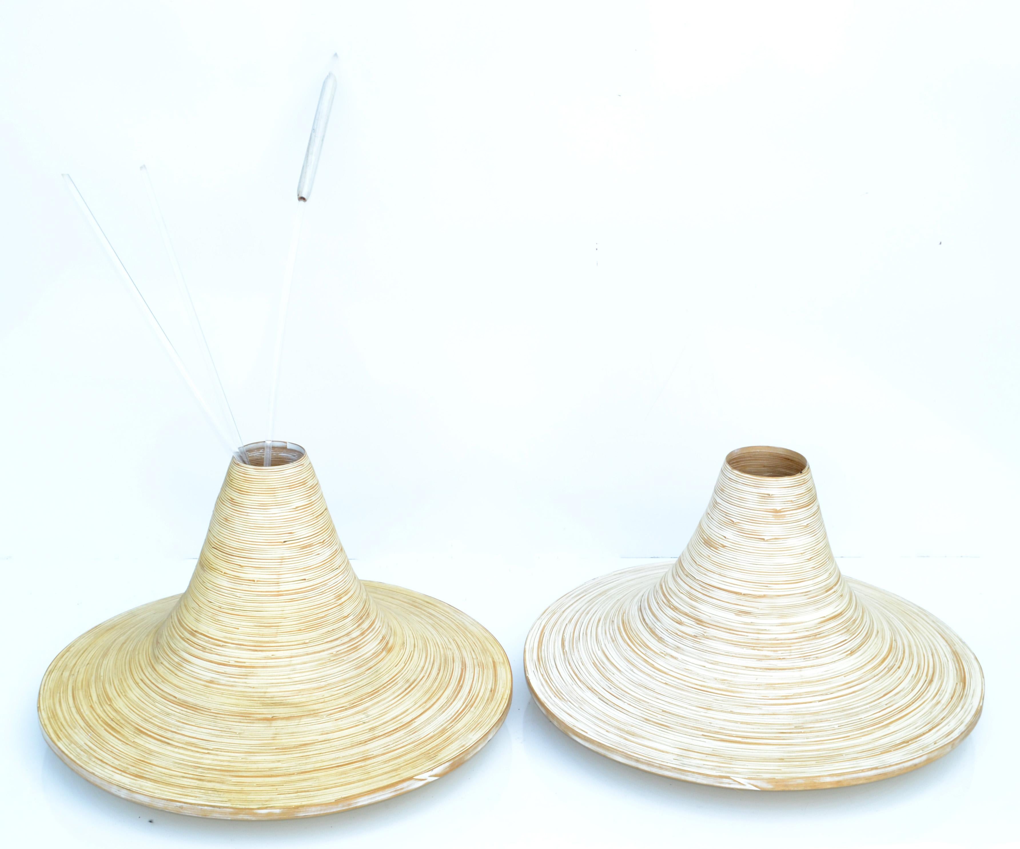 Pair of Beige Finish decorative indoor planters in swirled cane into this cone shaped Vessel.
Coming from a famous Florist in Paris, France.
The wood's natural coloring show of tones ranging from light beige, Taupe to a dark brown striped with