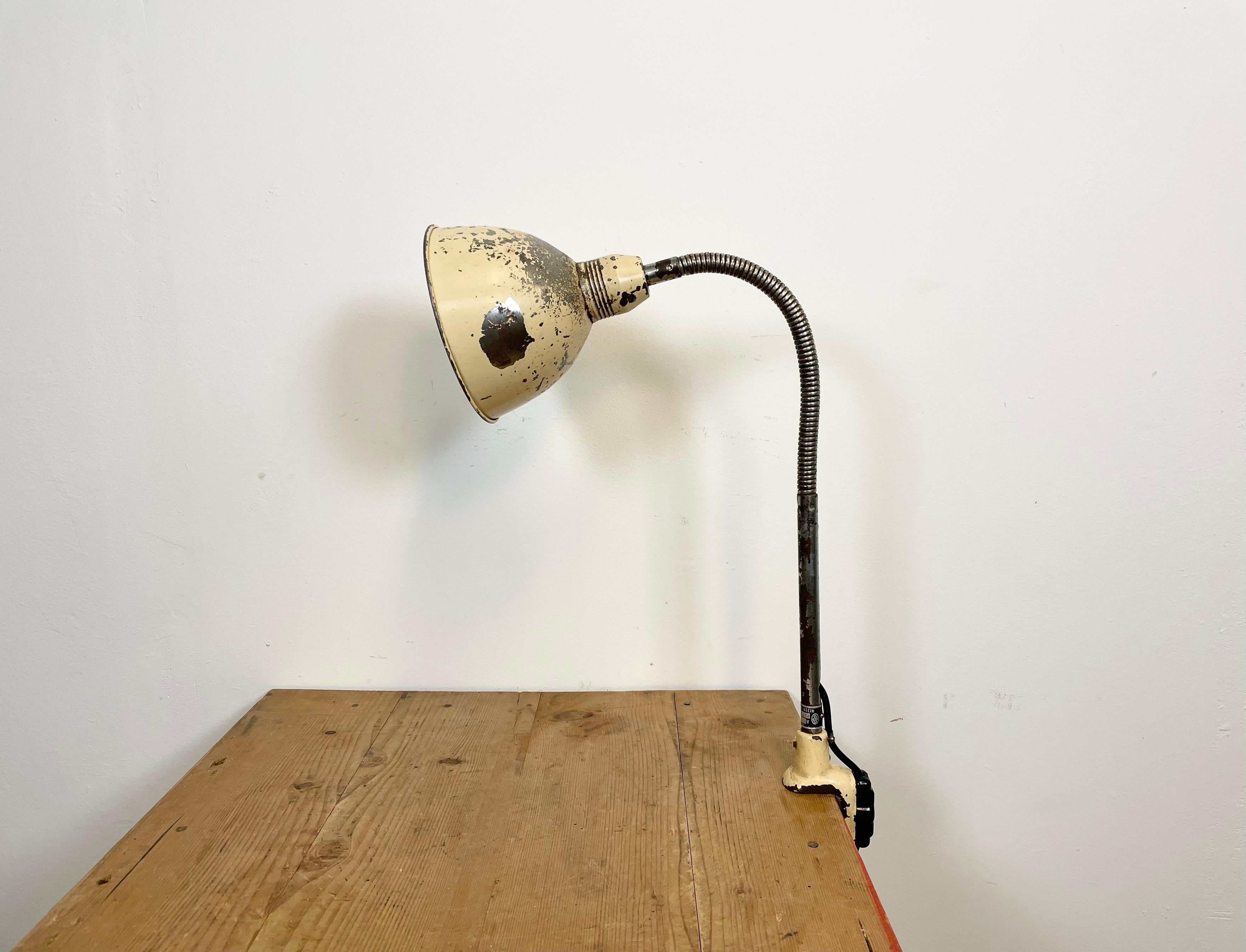 Industrial flexible gooseneck table lamp with clamp base made by Instala Decín in former Czechoslovakia during the 1960s. Good vintage condition. The socket requires standard E 27 / E26 light bulbs. The lampshade diameter is 17 cm.