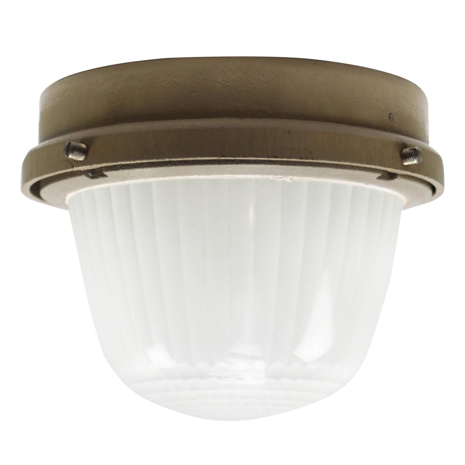 French Industrial wall / ceiling lamp by Holophane, France, model CE100
Beige cast iron with frosted cut glass.

Weight : 4.10 kg / 9 lb

Priced per individual item. All lamps have been made suitable by international standards for incandescent light
