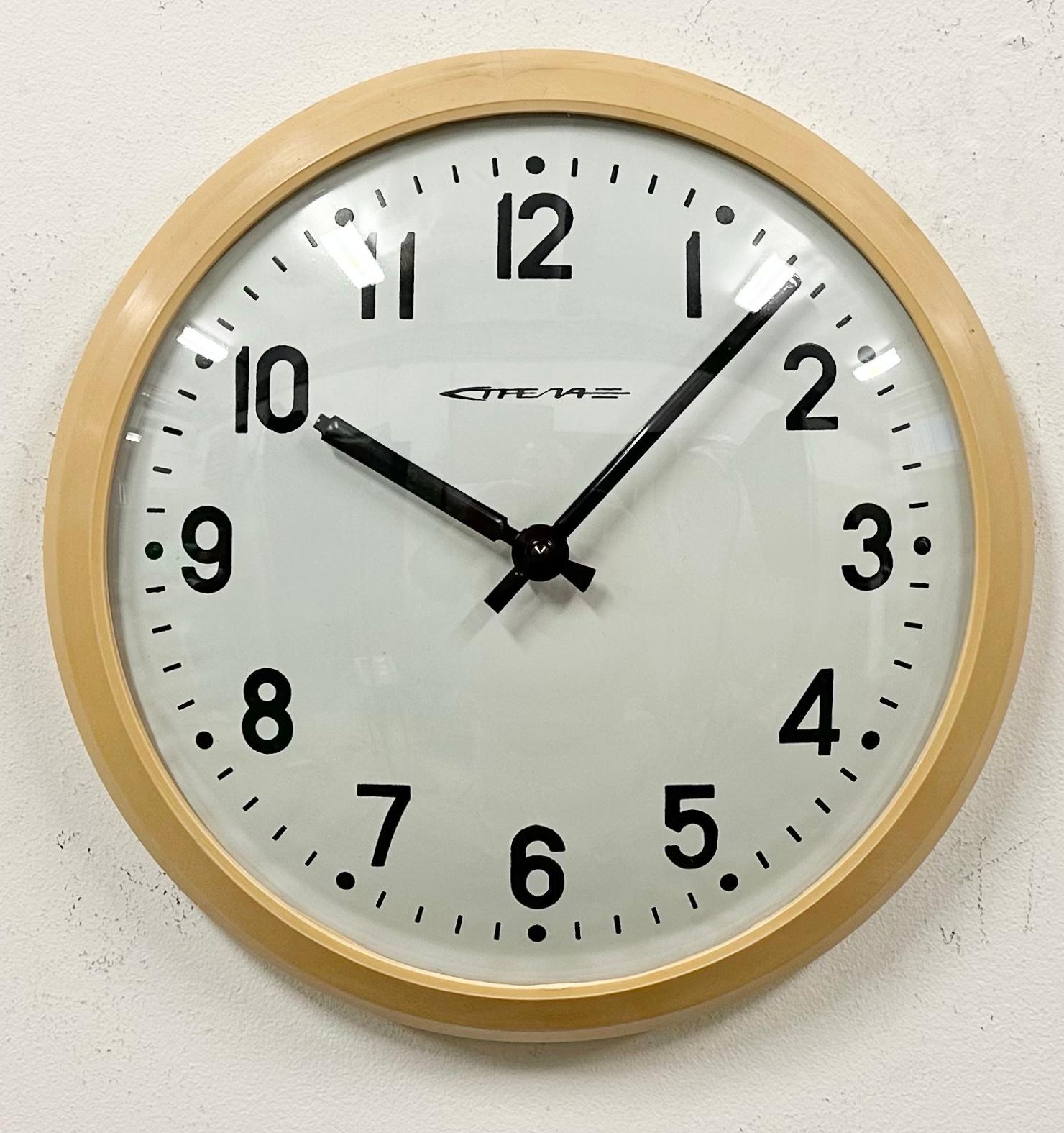 This wall clock was produced by Strela in former Soviet Union during the 1960s .It features a beige bakelite frame, an iron dial and a convex clear glass cover. The piece has been converted into a battery-powered clockwork and requires only one
