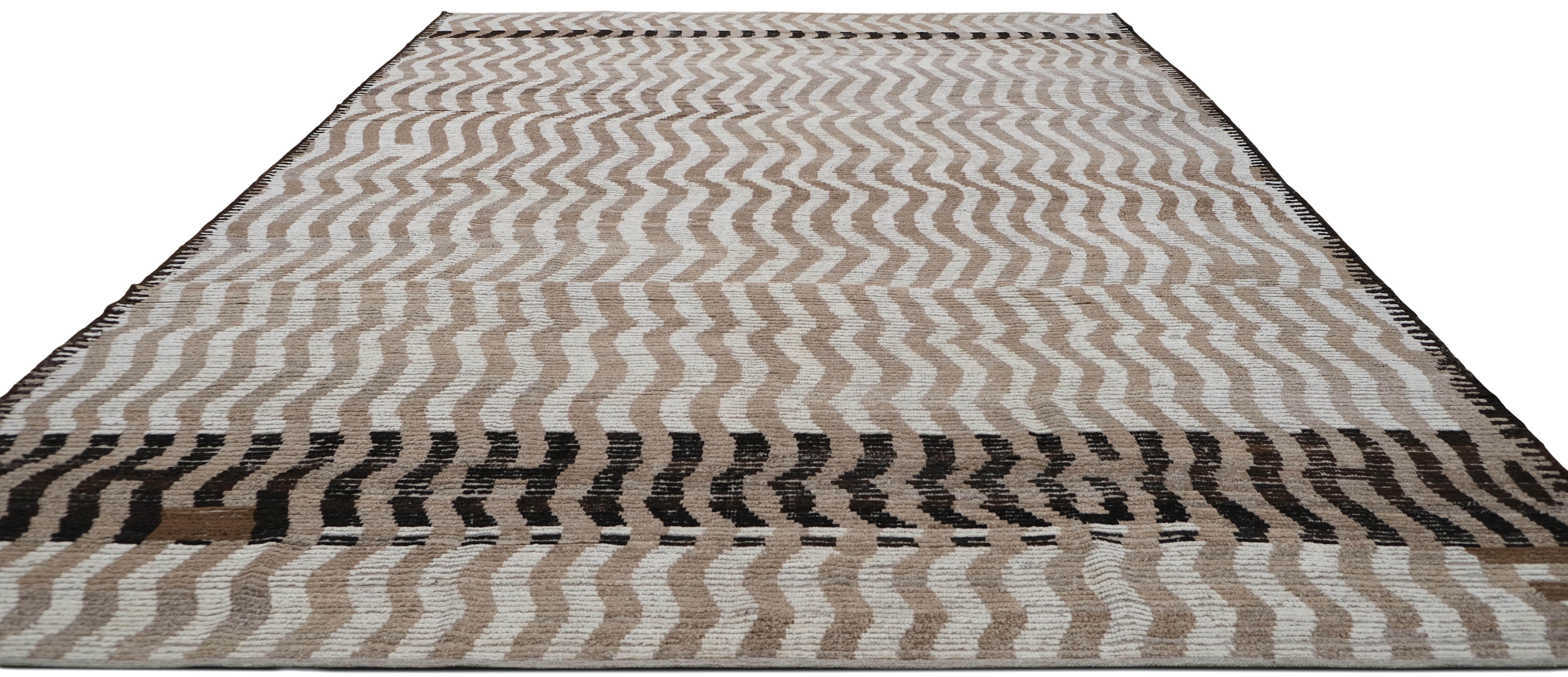 Transform your space with the mesmerizing design of this hand-knotted wool rug, featuring an optical illusion wave pattern. The dynamic, undulating lines in warm beige, ivory, and browns create a striking visual effect, bringing depth and movement