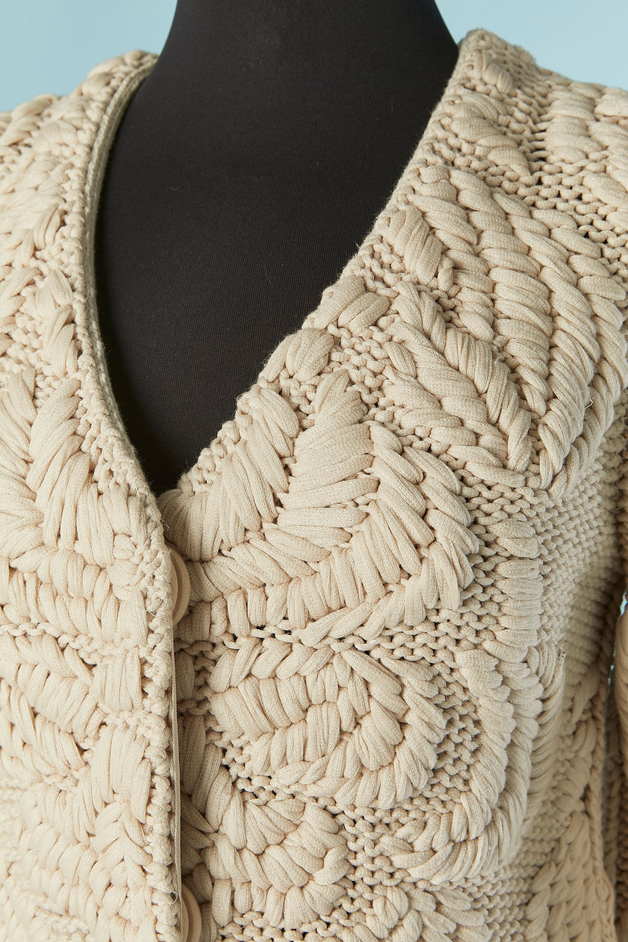 Beige knitted single-breasted coat . No knit composition tag but the knit is probably a mix of cotton and nylon. 
Snap closure on the middle front . 
SIZE 38 (Fr) M 