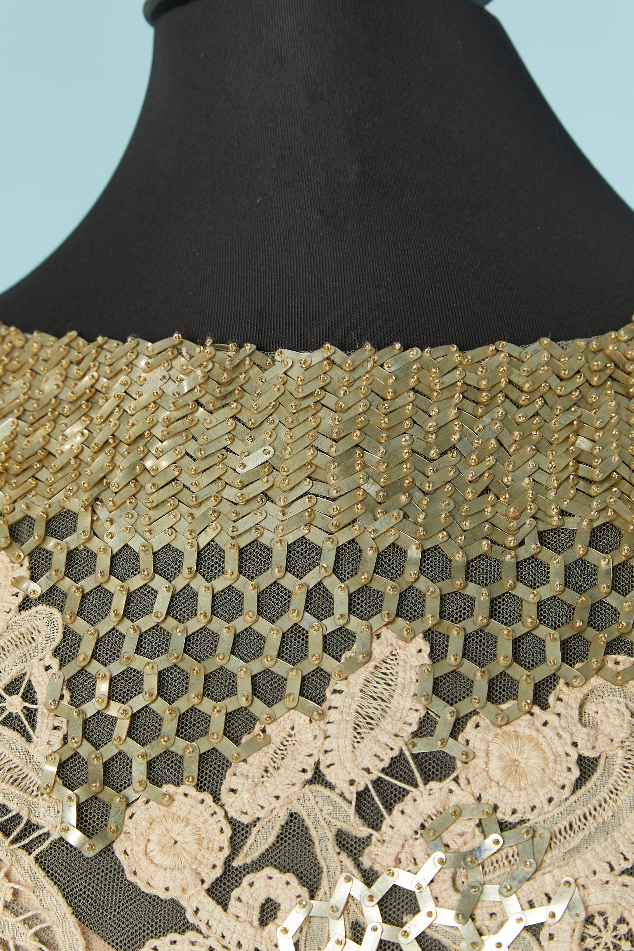 beige lace and tulle evening dress with gold beadwork . See-through on the back. Silk chiffon lining inside the skirt and top front. Zip closure on the middle back. 
SIZE 8 / M 
Total front lenght: 150cm
Total back lenght: 185cm