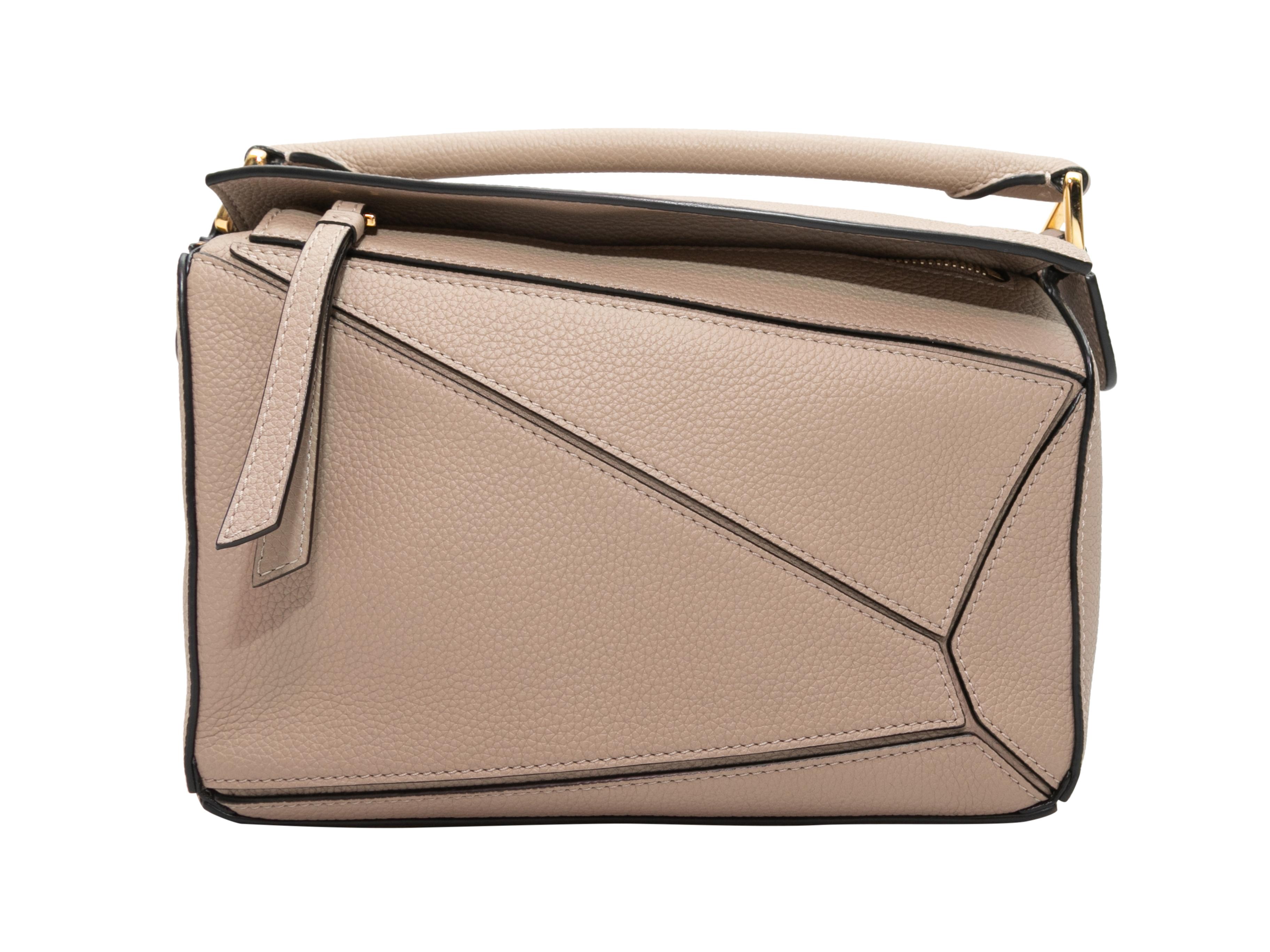 Beige Loewe Small Leather Puzzle Crossbody Bag. The Small Puzzle Crossbody Bag features a leather body, gold-tone hardware, a single flat top handle, a single flat crossbody strap, and a top zip closure. 9.5