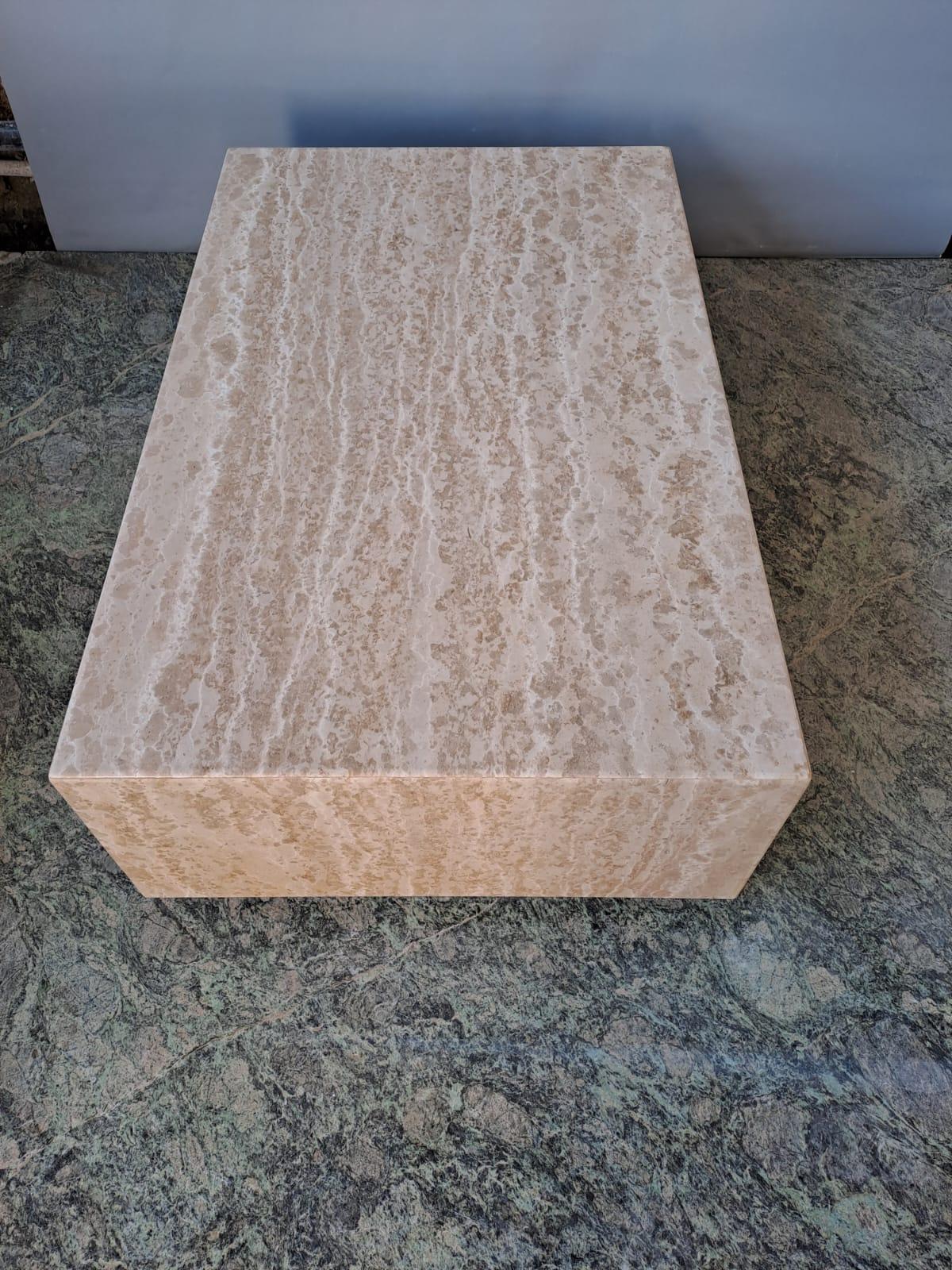 Elevate your living space with our Trani Marble Coffee Table, a masterpiece of timeless luxury and Italian craftsmanship. This exquisite coffee table is meticulously crafted from genuine Trani marble, renowned for its rich, creamy white tones and