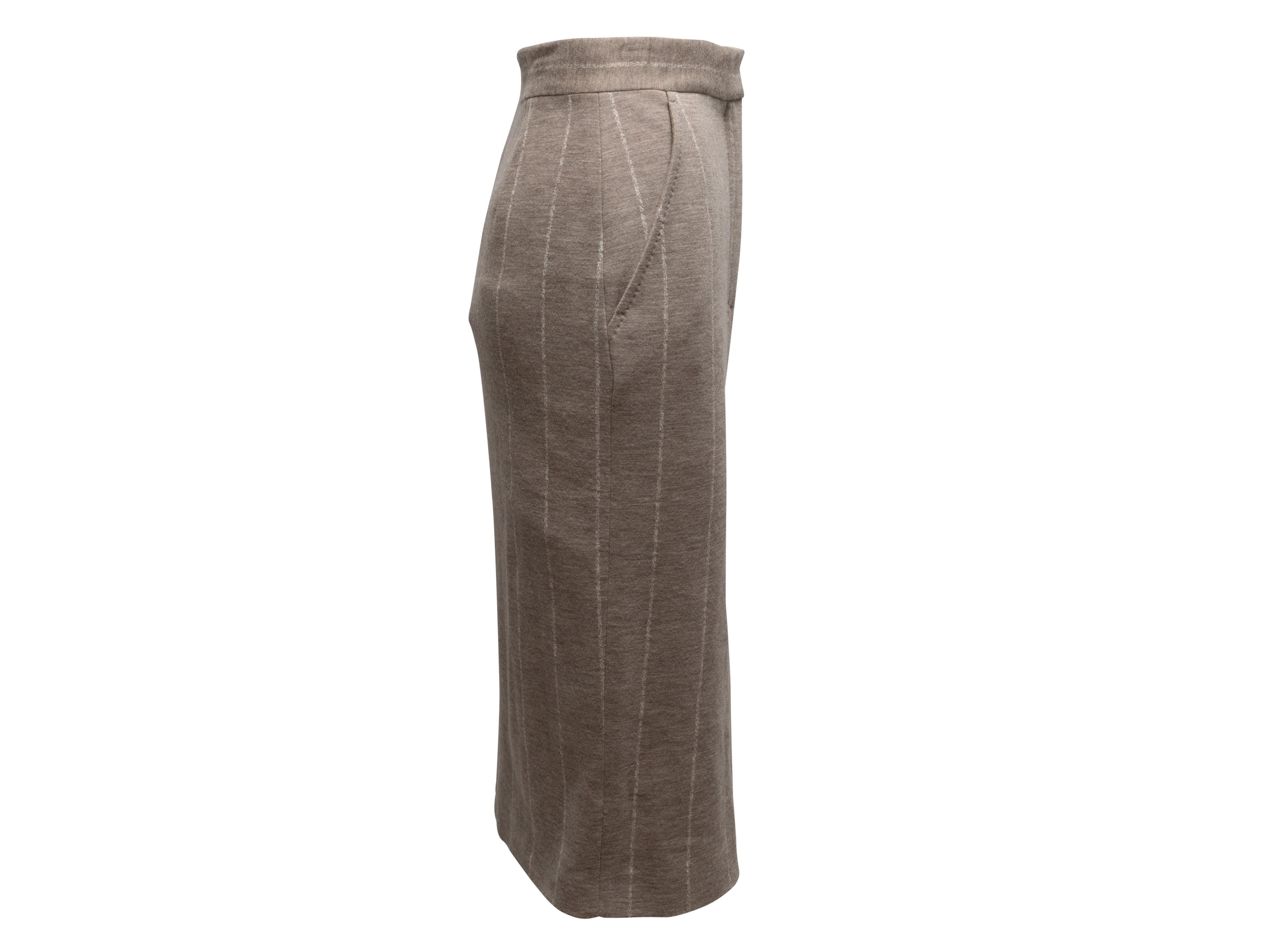 Product Details: Beige striped virgin wool pencil skirt by Max Mara. Dual hip pockets. Front zip and hook-and-eye closures. 27