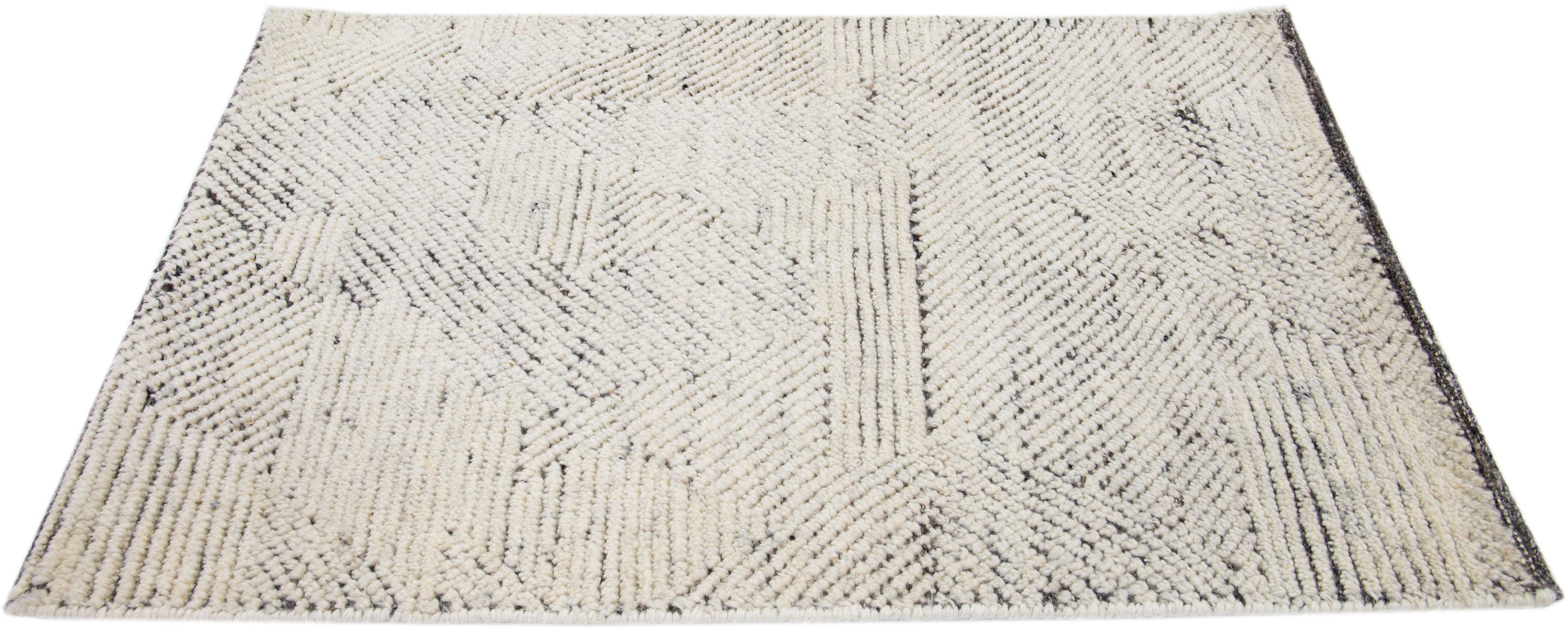 Apadana's Modern Moroccan Style wool custom rug. Custom sizes and colors made-to-order.

Material: 80 Wool and 20 Cotton.
Techniques: Hand-Loomed.
Style: Moroccan.
Lead time: Approx. 15-16 weeks available.
Colors: As shown, other custom colors are