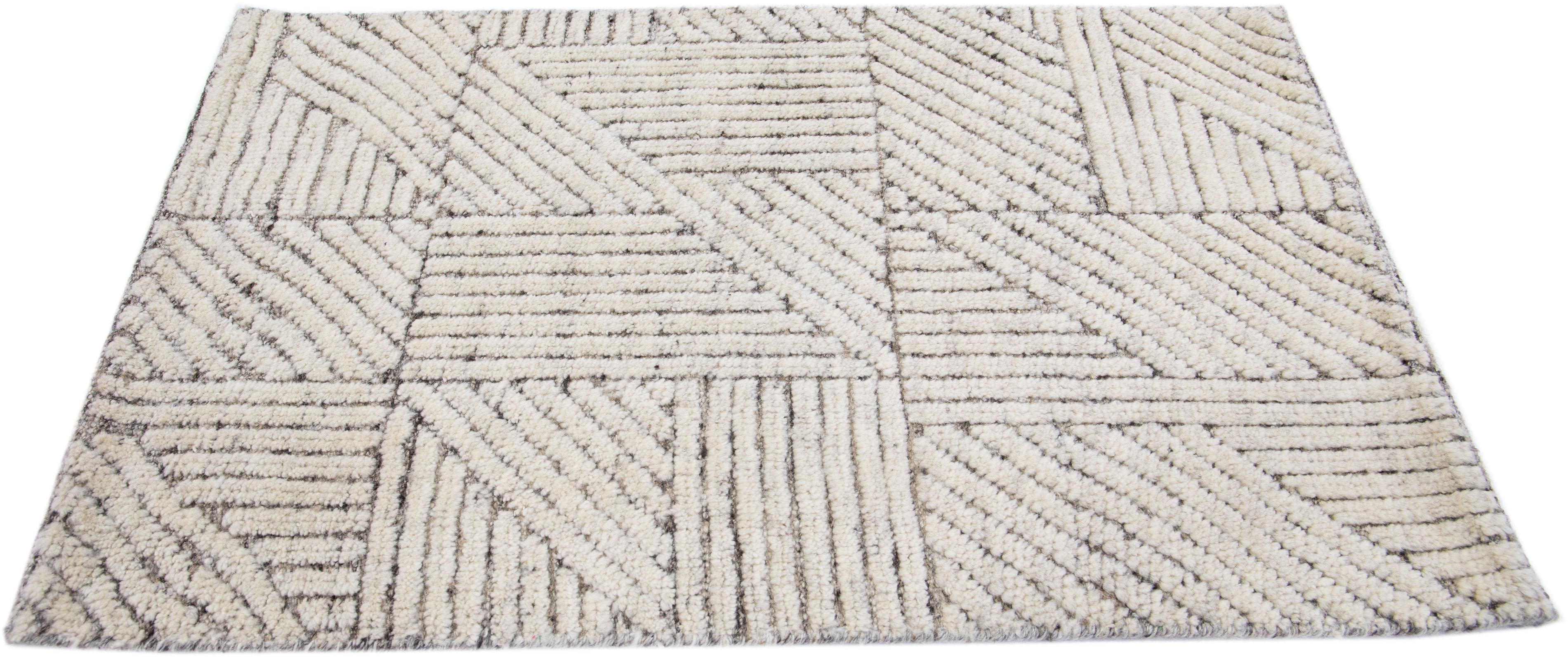 Apadana's Modern Moroccan Style wool custom rug. Custom sizes and colors made-to-order.

Material: 80 Wool and 20 Cotton.
Techniques: Hand-Loomed.
Style: Moroccan.
Lead time: Approx. 15-16 weeks available.
Colors: As shown, other custom colors are