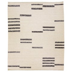 Tapis en laine beige de style marocain moderne et géométrique fait à la main