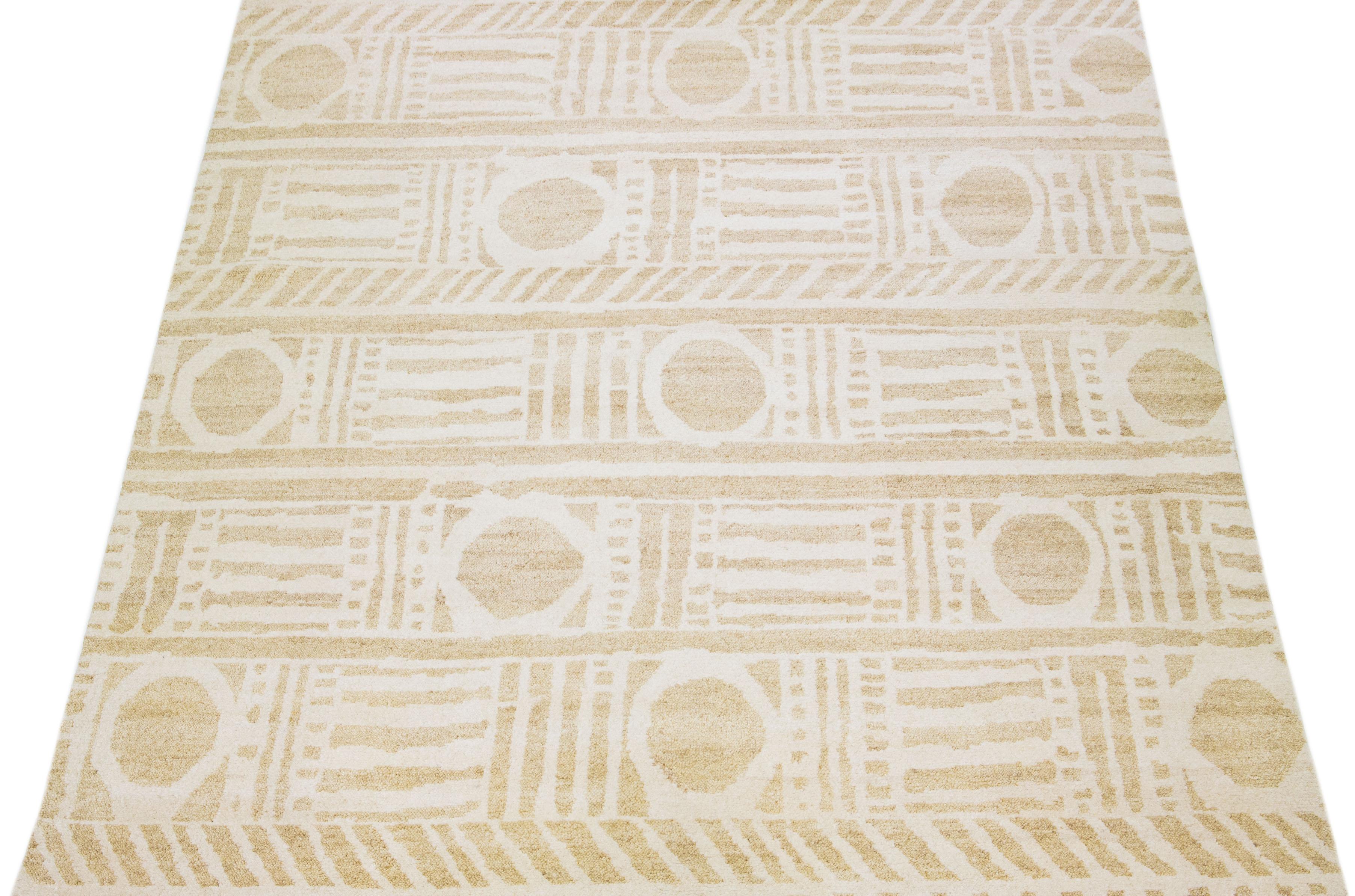 Beautiful Moroccan-style handmade wool rug with a beige color field. This Modern rug has ivory accents featuring a gorgeous all-over geometric boho motif.

This rug measures: 12' x 15'.

Our rugs are professional cleaning before shipping.