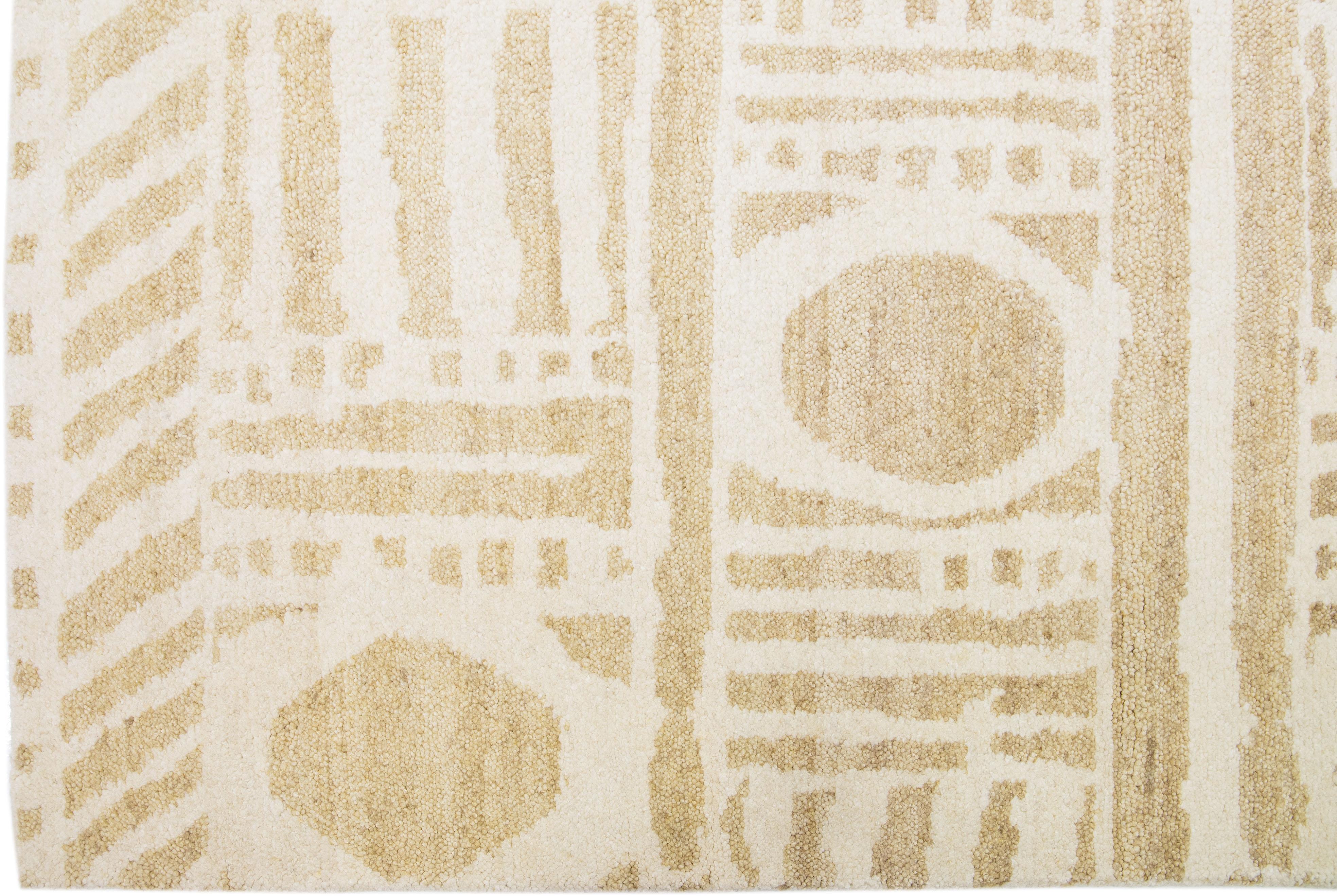 Bohemian Beige Modern Moroccan Style Handmade Wool Rug with a Ivory Geometric Design  For Sale