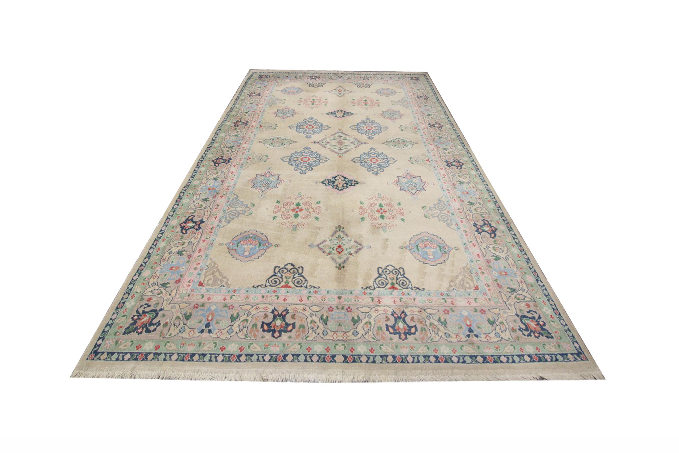 This beautiful area floor rug has been handwoven in subtle yet captivating colourways.  A multi-layered border frames the gorgeous centrepiece starting with a narrow, thin navy border followed by a green floral pattern and a thicker geometric