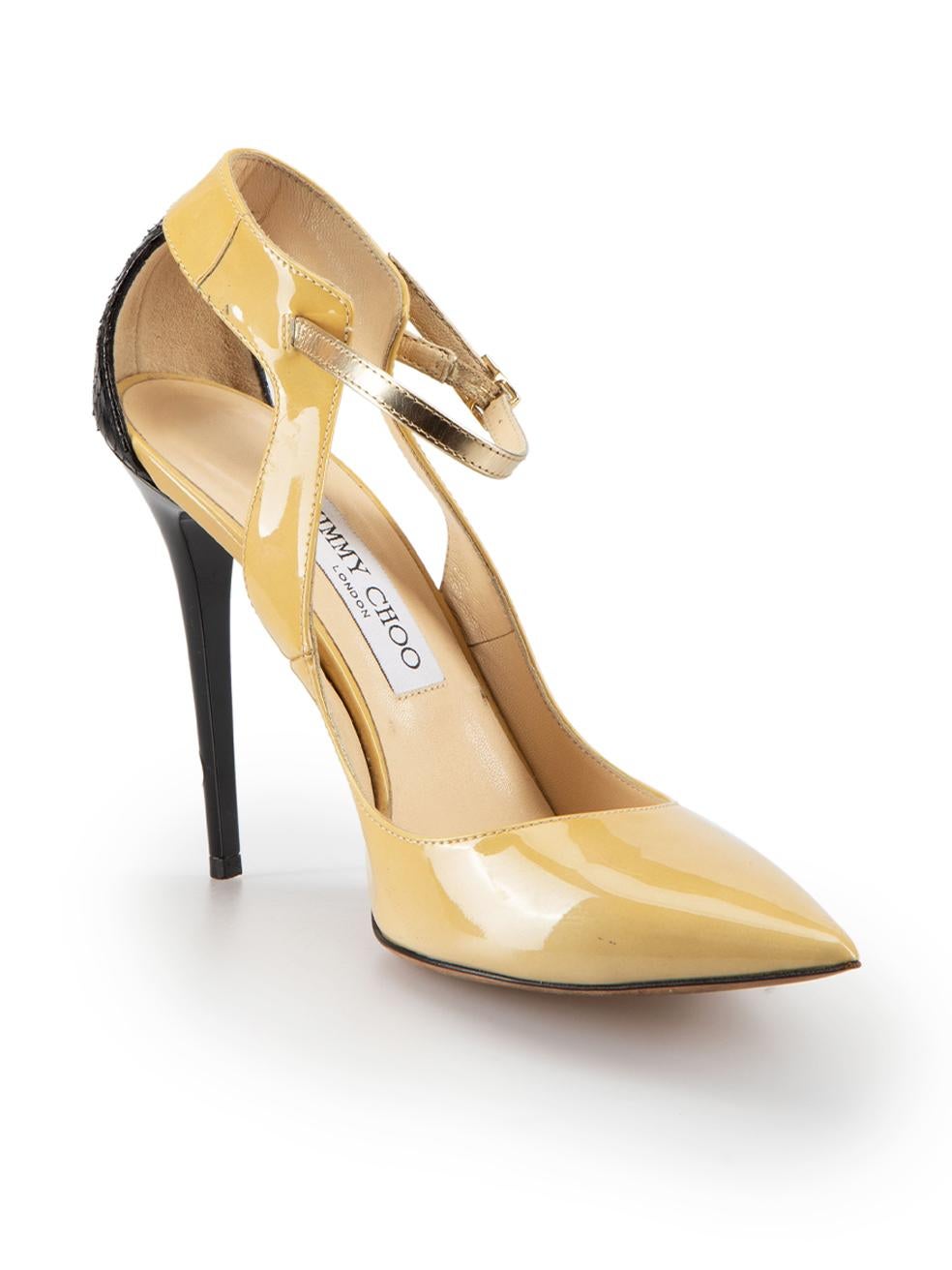 CONDITION is Good. Minor wear to shoes is evident. Light wear to the patent leather panels with dark marks and both heels have indents on this used Jimmy Choo designer resale item.



Details


Beige

Patent leather

Heels

Black snakeskin back