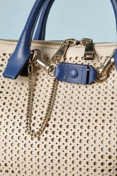Beige perforated leather bag with blue leather handle and bottom Chloé