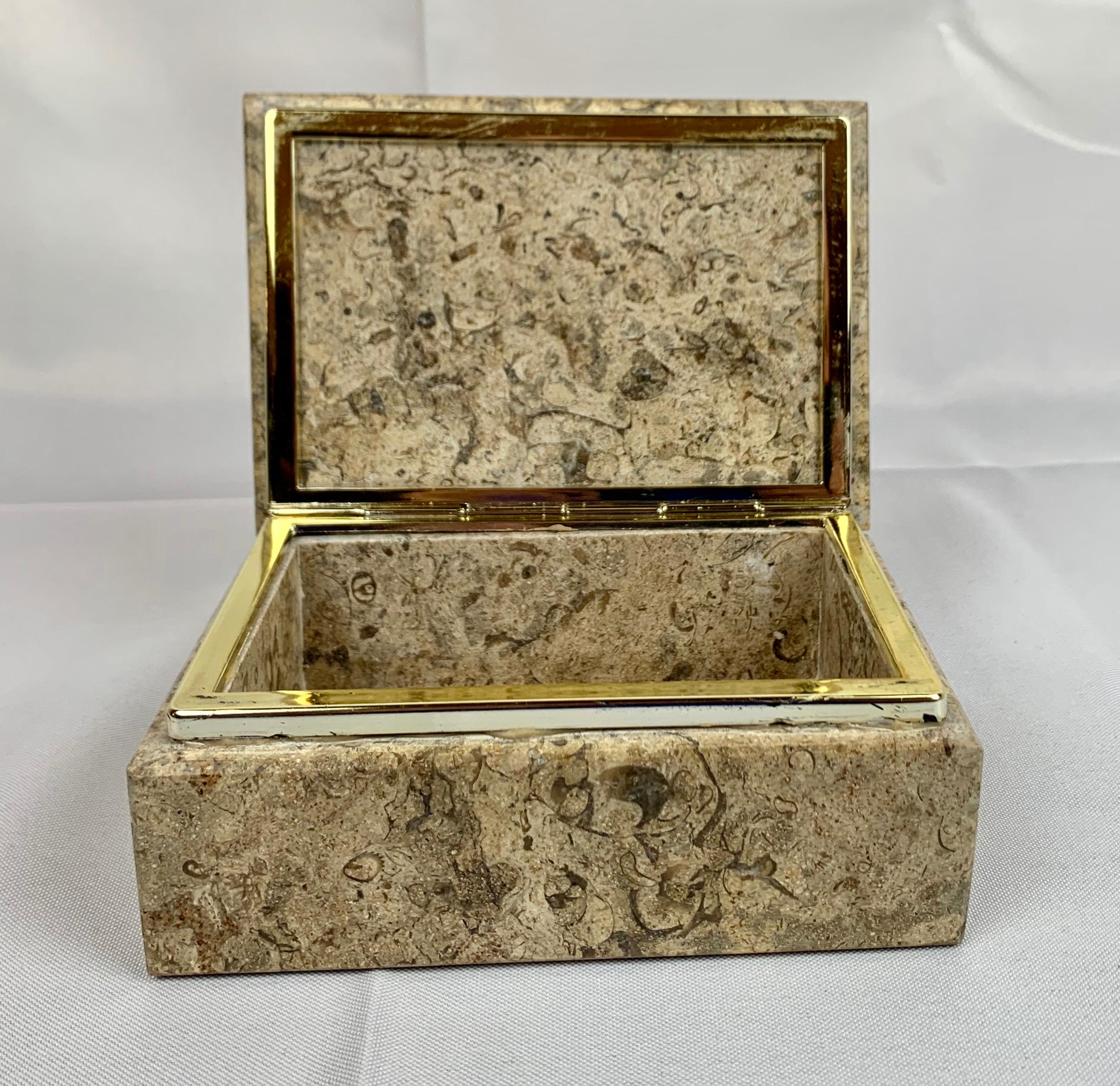 A hinged Rectangular light beige stone box with silvered frame.
Perfect for jewelry, keepsakes or on a desk to hold paperclips..........
Why not place it on a table just for good looks.
top-5.5