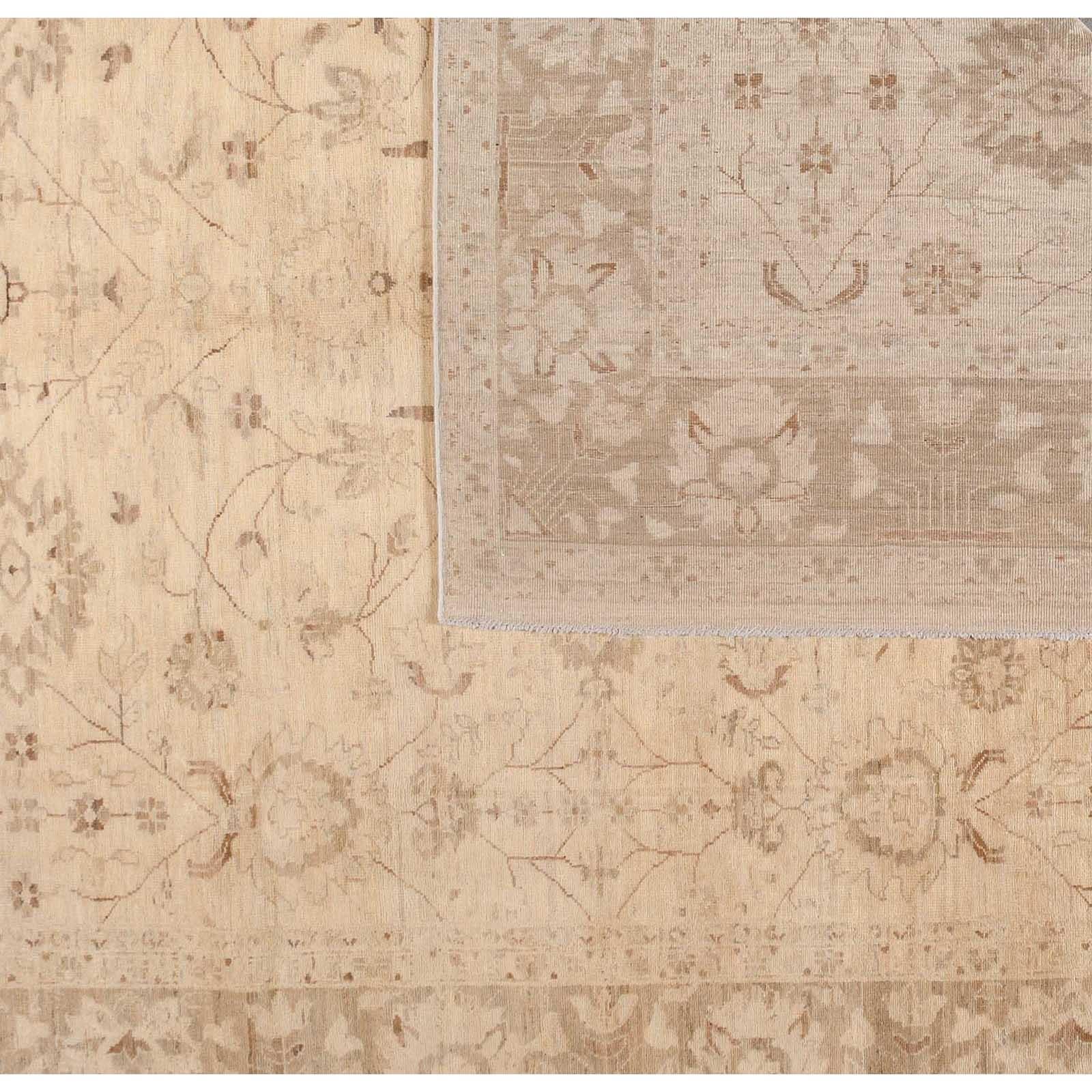 Neutral beige tones and a delicate floral design make for a very versatile rug that can unify and complete any space. Wool. Hand knotted in Pakistan using vegetal dyes.
