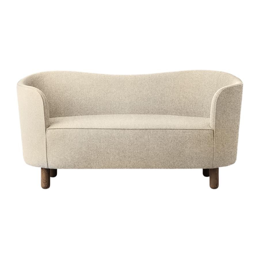 Beige Sahco zero and smoked oak mingle sofa by Lassen
Dimensions: W 154 x D 68 x H 74 cm 
Materials: Textile, oak.

The Mingle sofa was designed in 1935 by architect Flemming Lassen (1902-1984) and was presented at The Copenhagen Cabinetmakers’