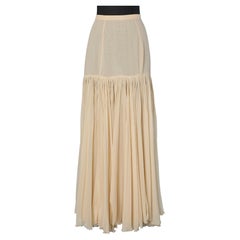 Gonna in chiffon di seta beige plissettata e aperta fino ai fianchi Rochas