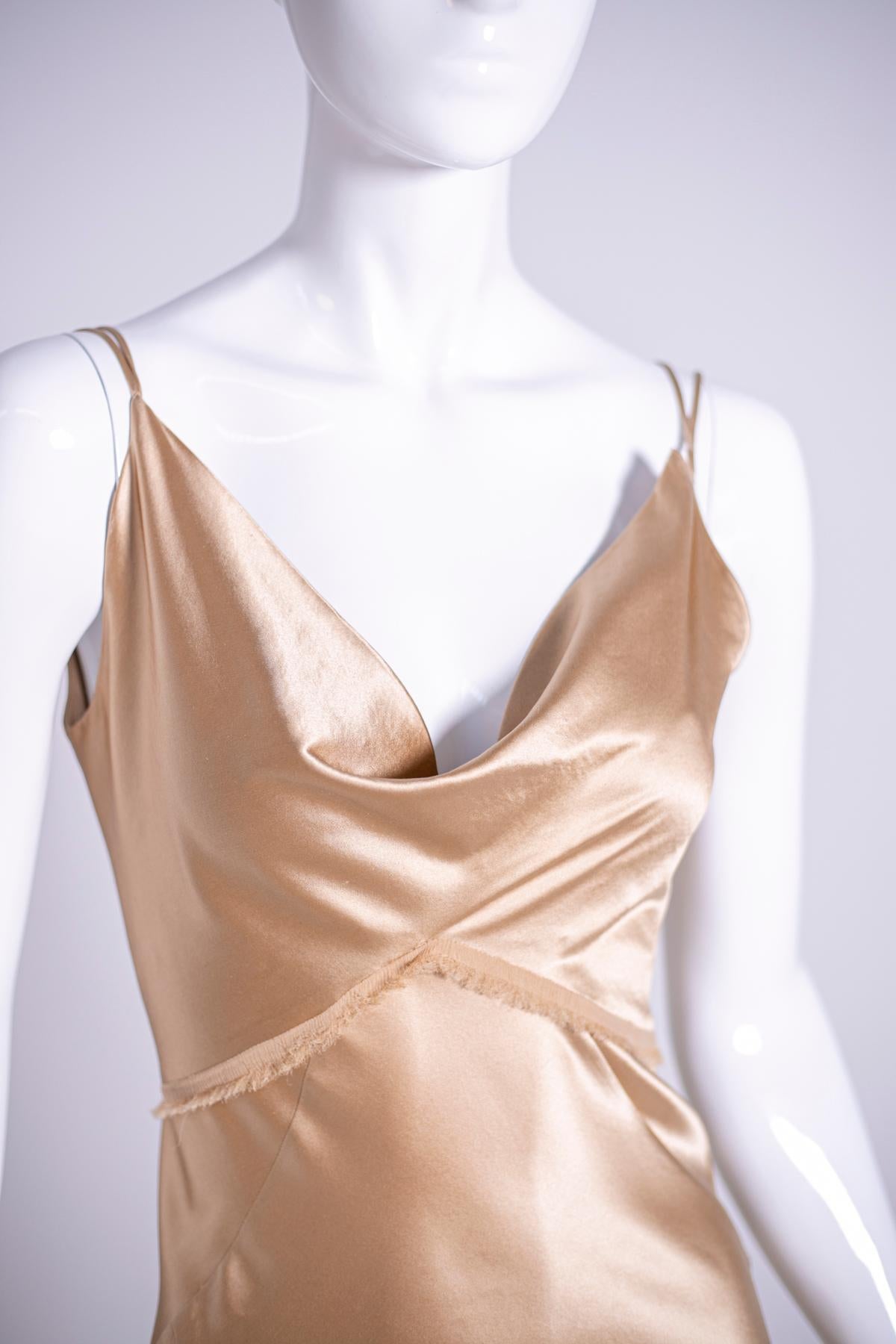 Ermanno Scervino 1990's beige silk evening dress.
Gorgeous vintage long evening dress Ermanno Scervino, in beige silk, with soft neckline on the chest, double and thin braces and a small tail at the back that make this dress simple but