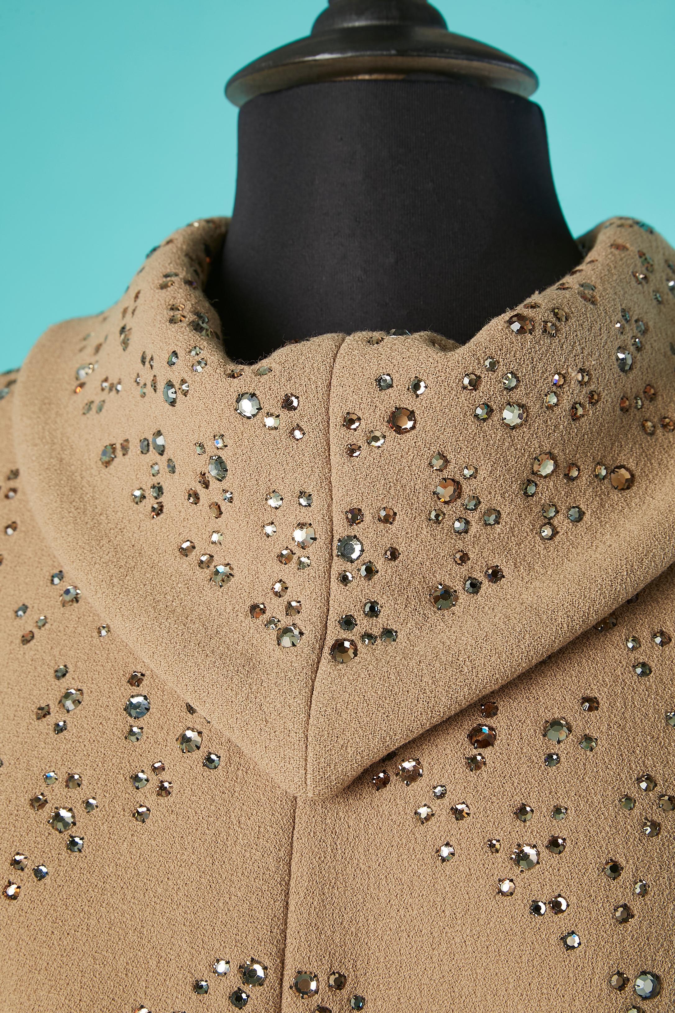 Beige sleeveless cocktail dress with 3 colors rhinestone. Silk lining. Zip in the middle back + hook& eye 
Size L 
Pauline Trigère (November 4, 1908 – February 13, 2002) was a Franco-American couturière. Her award-winning styles reached their height