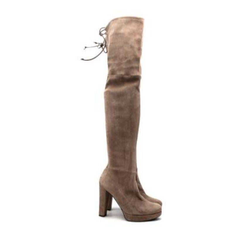Stuart Weitzman Beige Suede Highlander OTK Heeled Boots
 
 - Light beige stretch suede
 - Set on a high block heel
 - Self-tie cord behind the knee
 
 Suede
 Made in Spain 
 
 PLEASE NOTE, THESE ITEMS ARE PRE-OWNED AND MAY SHOW SIGNS OF BEING STORED