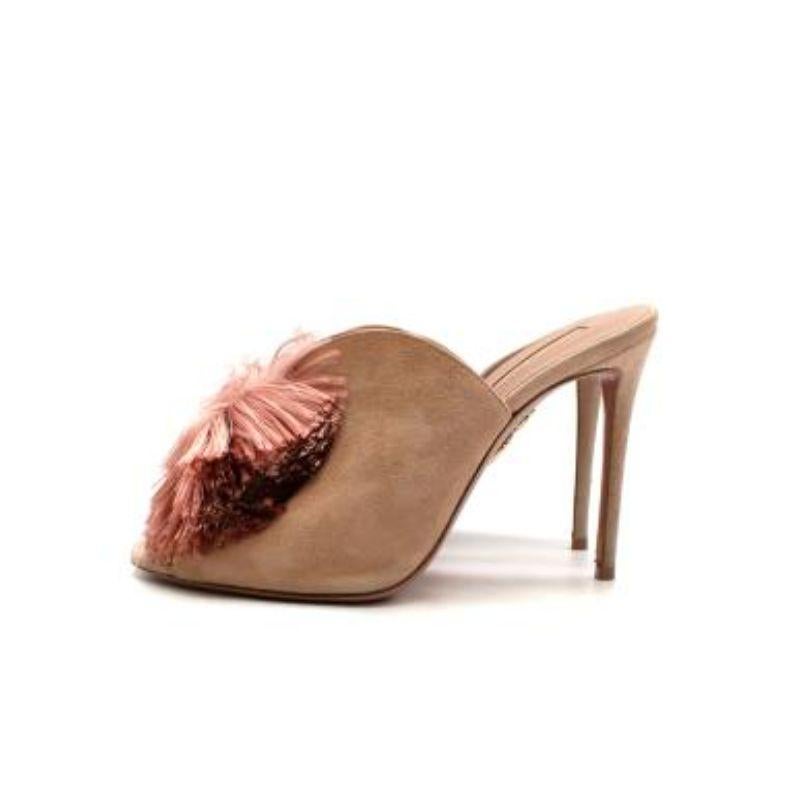 Aquazzura beige suede & pink tasseled Lotus Blossom heeled mules
 
 
 
 - High, sculpted vamp in beige suede, adorned with coral pink bow-shaped tassels 
 
 - Set on a high stiletto heel
 
 - Slip on
 
 - Leather lined 
 
 
 
 Materials:
 
 99% Goat