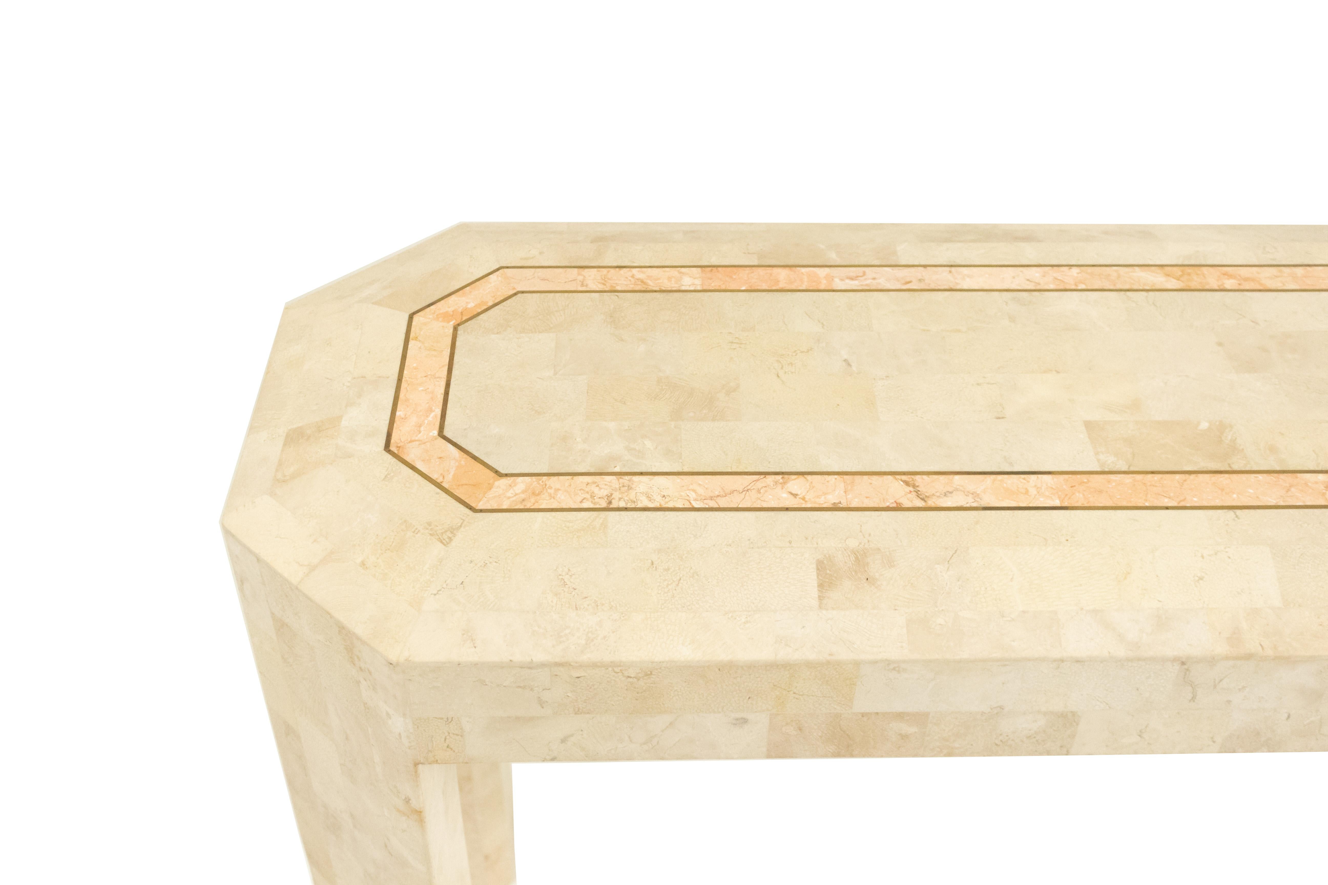 American midcentury beige tessellated hardstone faceted console table with pink hardstone and brass inlay border.