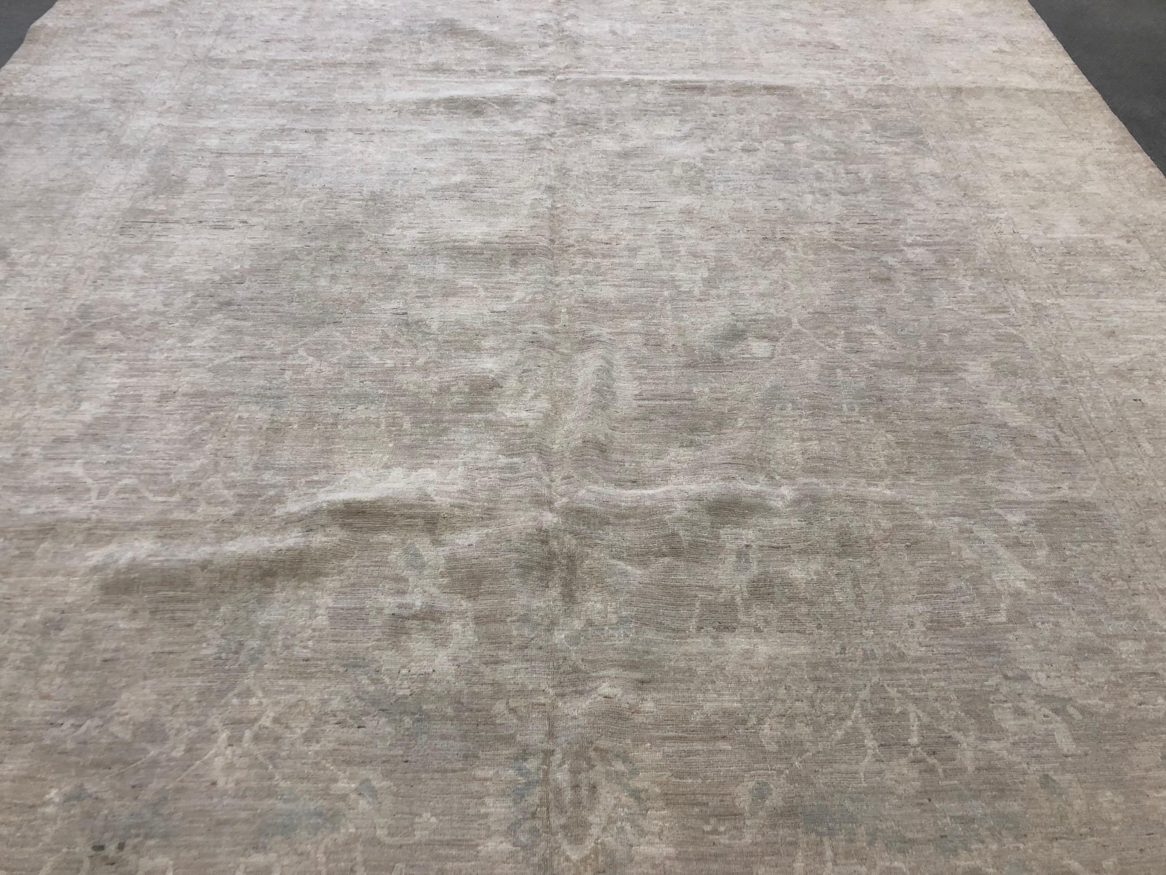 Neutral beige, tan and taupe tones make this elegant traditional style area rug one of the most versatile rugs you'll find. Hand knotted wool also makes it one of the most durable. Great for the living room or bedroom. Made in Pakistan using vegetal